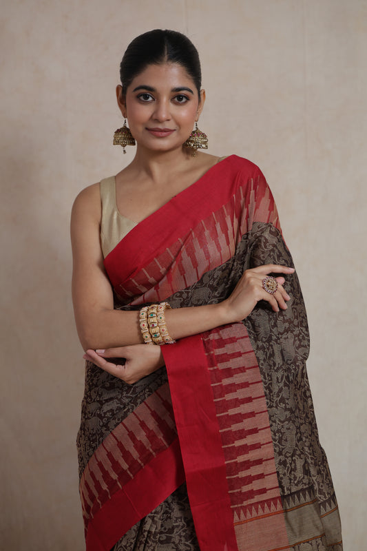 Portrait view of Kanchipuram handloom cotton saree with woven motifs and red contrast border