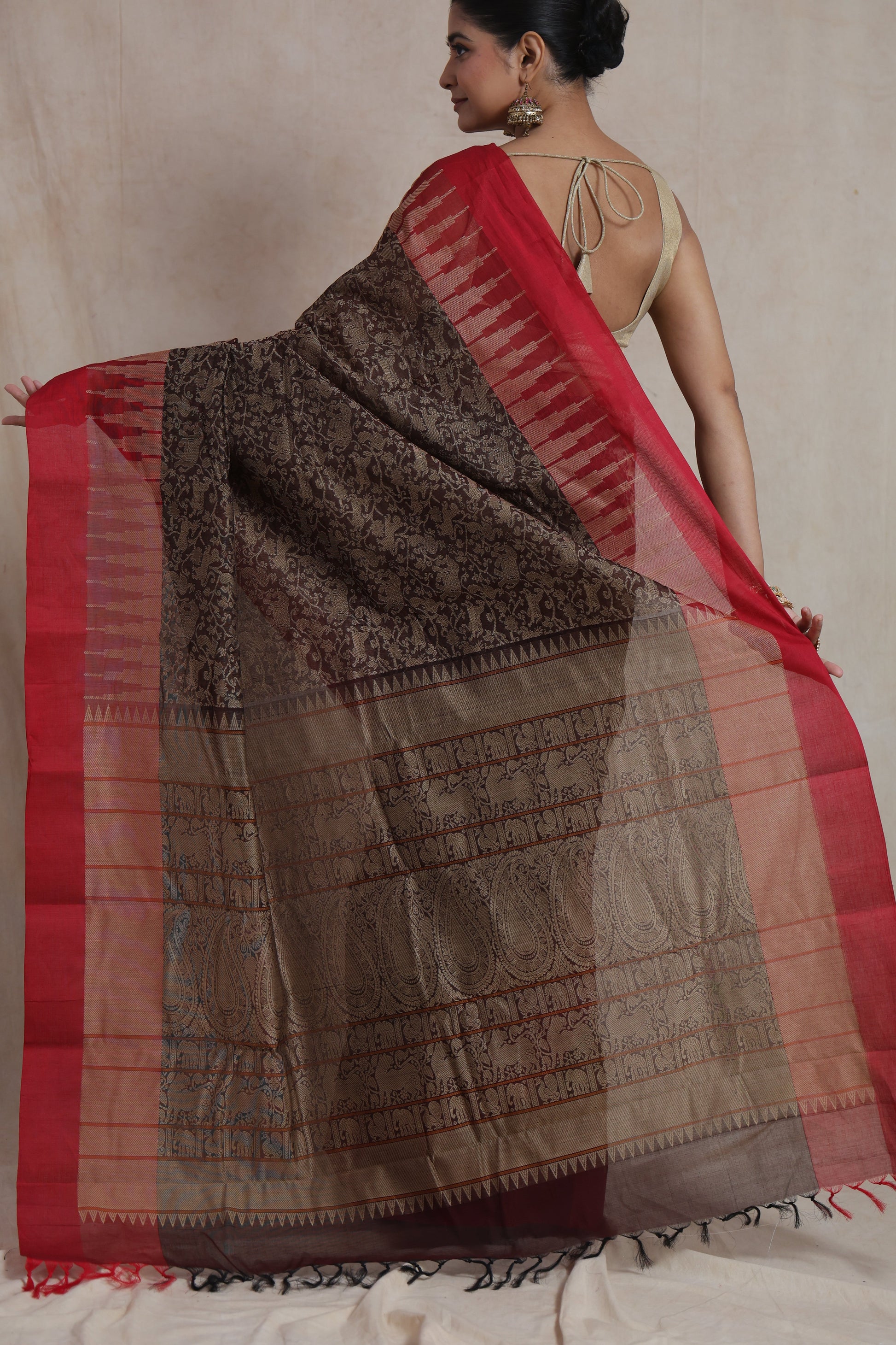 Back view of black Kanchipuram handloom cotton saree with crimson red border and woven pallu