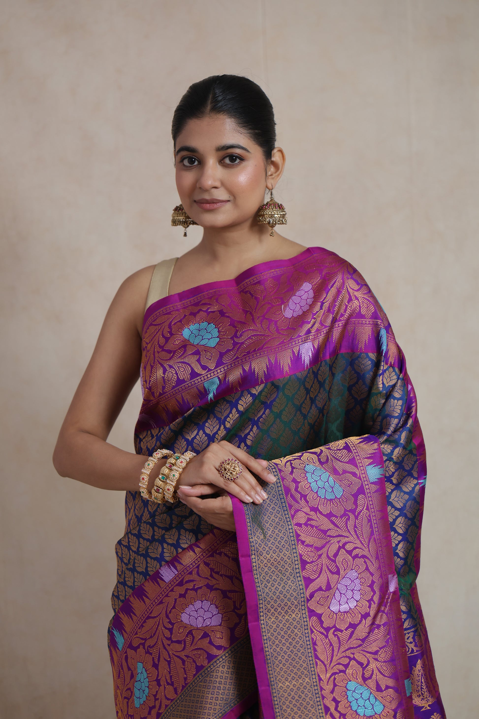 Close-up of Gadwal Silk Saree featuring navy blue body and magenta floral border