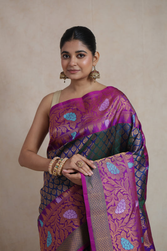 Close-up of Gadwal Silk Saree featuring navy blue body and magenta floral border