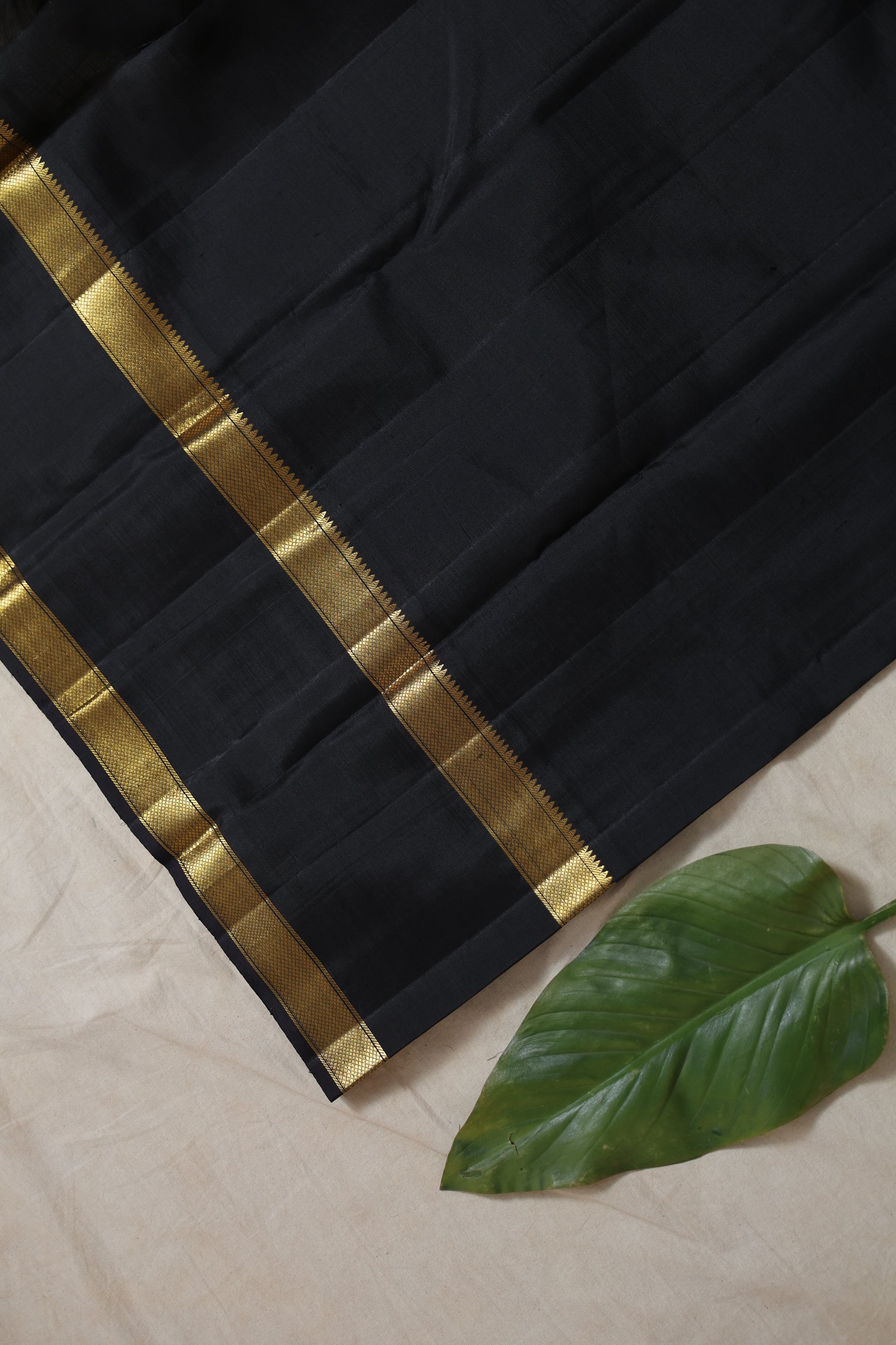 Rich black pallu of Kanjivaram pure silk saree featuring elegant traditional woven detailing