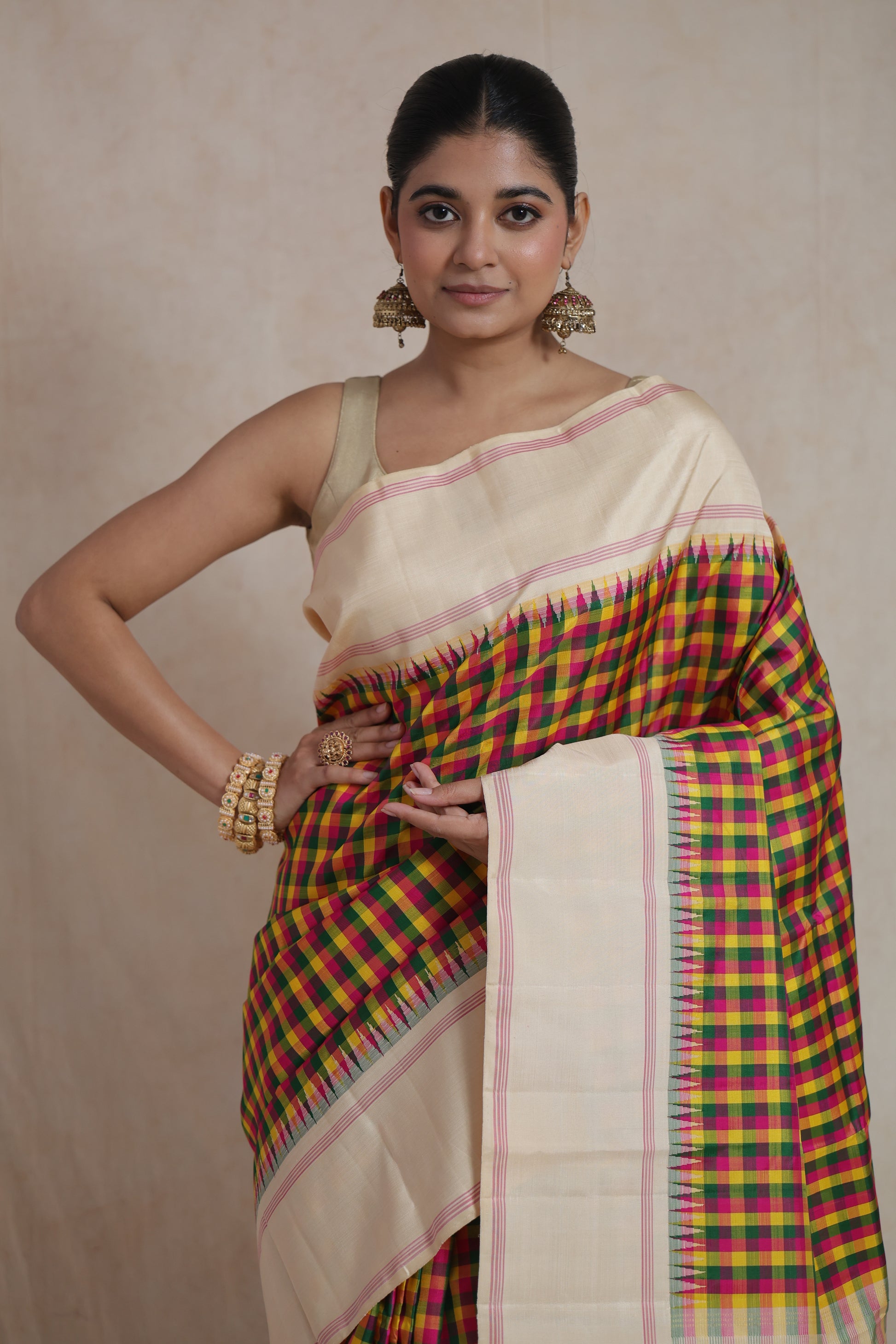 Close-up view of ivory Kanjivaram pure silk saree showcasing multicolor checks and refined border design