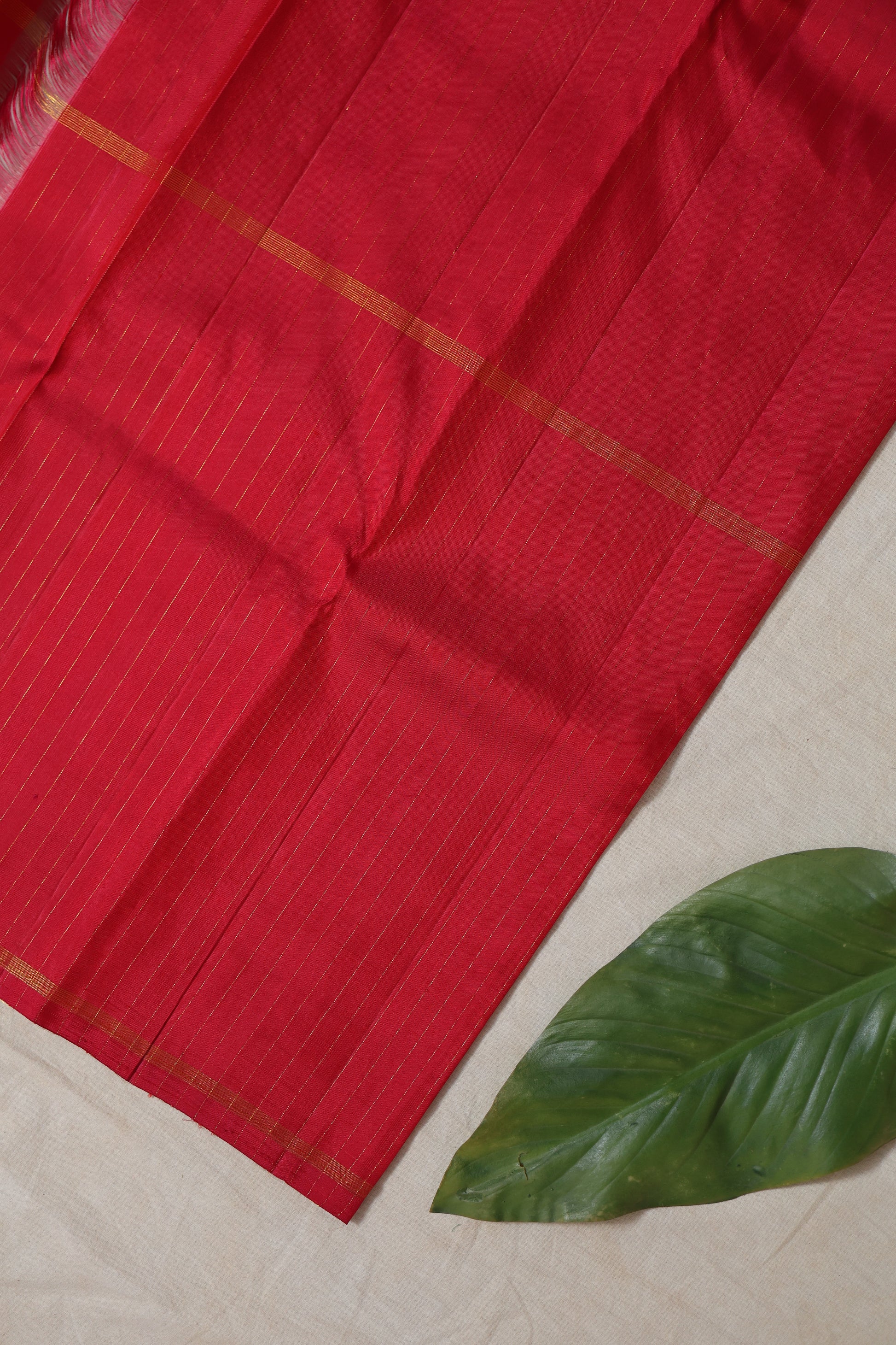 etailed fabric view of peacock blue Kanjivaram pure silk saree with fine woven texture