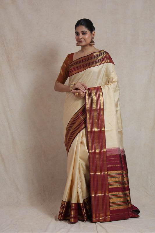 Ivory Kanjivaram pure silk saree with maroon woven border and traditional South Indian pallu