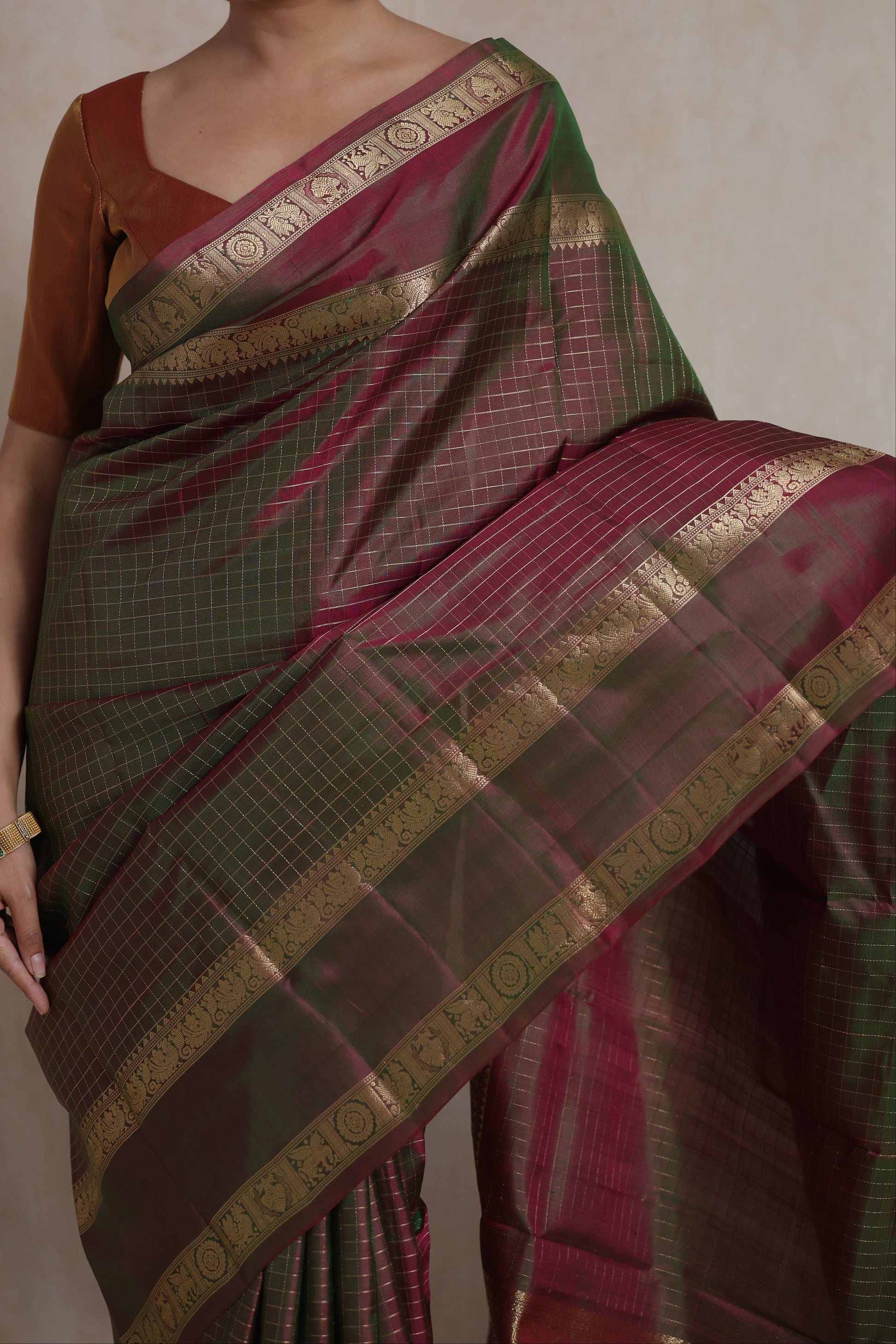 Detailed view of Kanjivaram pure silk saree in olive green and wine shades with classic South Indian woven artistry