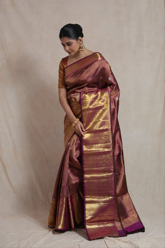 Elegant drape of mauve Kanjivaram pure silk saree showcasing traditional woven craftsmanship