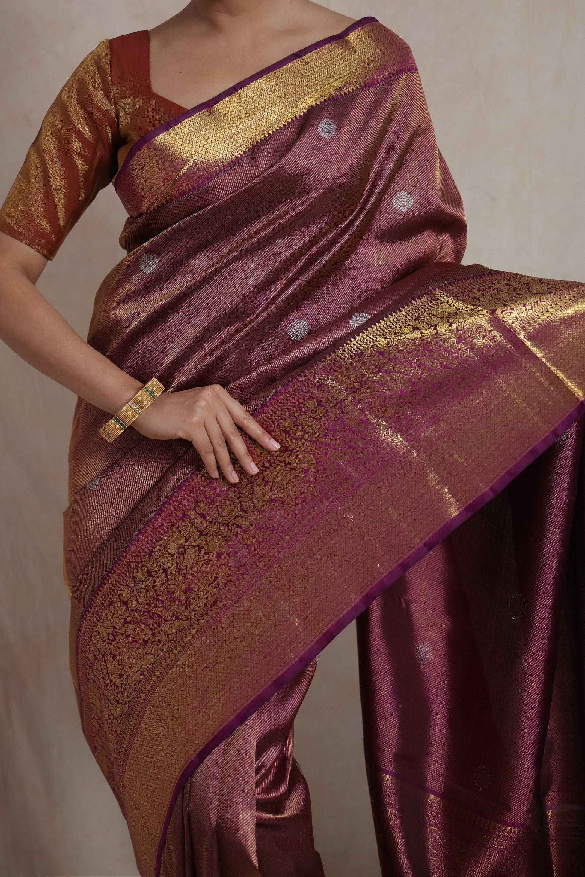 Detailed view of silver buttas and intricate gold woven pallu on Kanjivaram pure silk saree