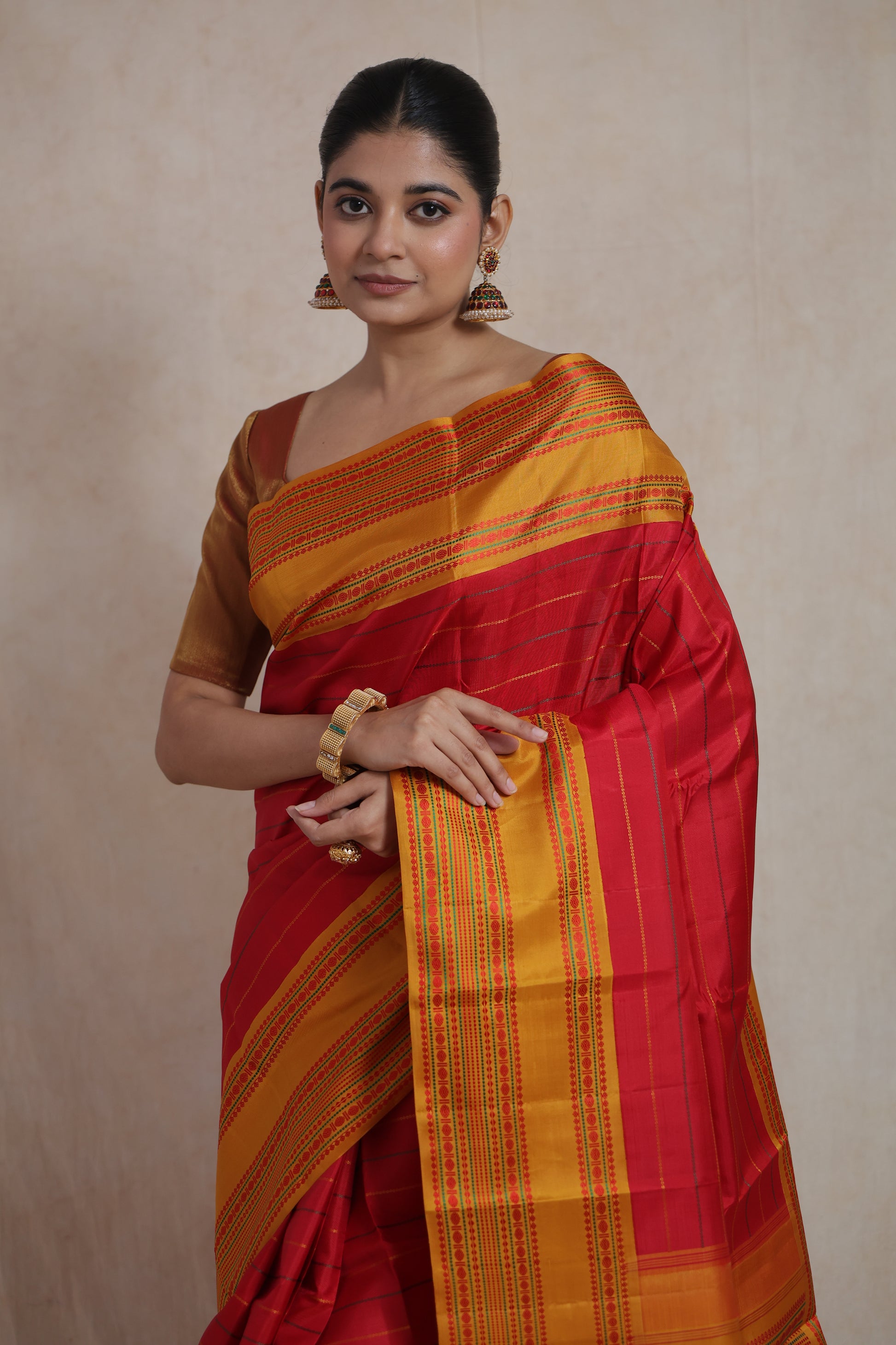Close-up of traditional woven pallu and mustard gold border on Kanchipuram silk saree