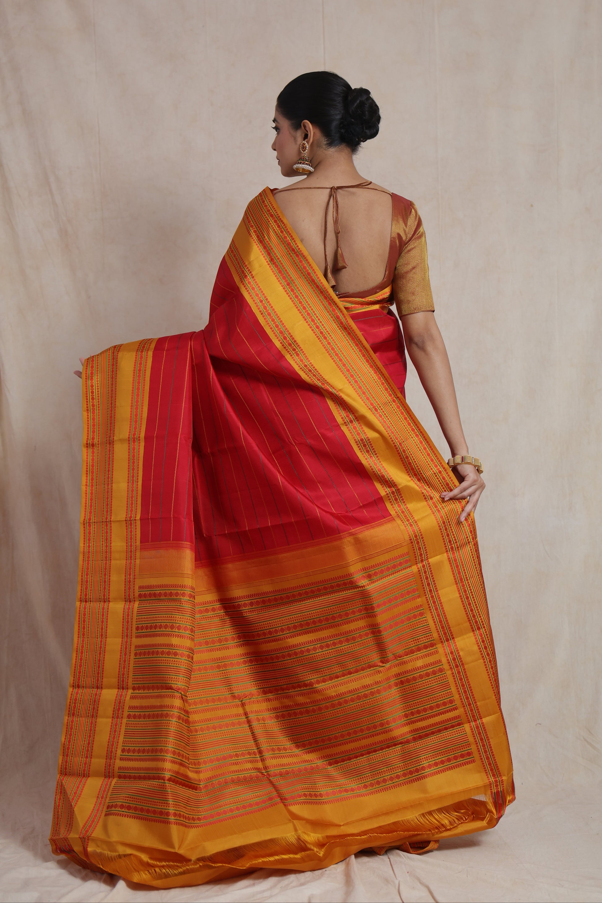 Back view of Kanchipuram silk saree highlighting intricate pallu and border craftsmanship