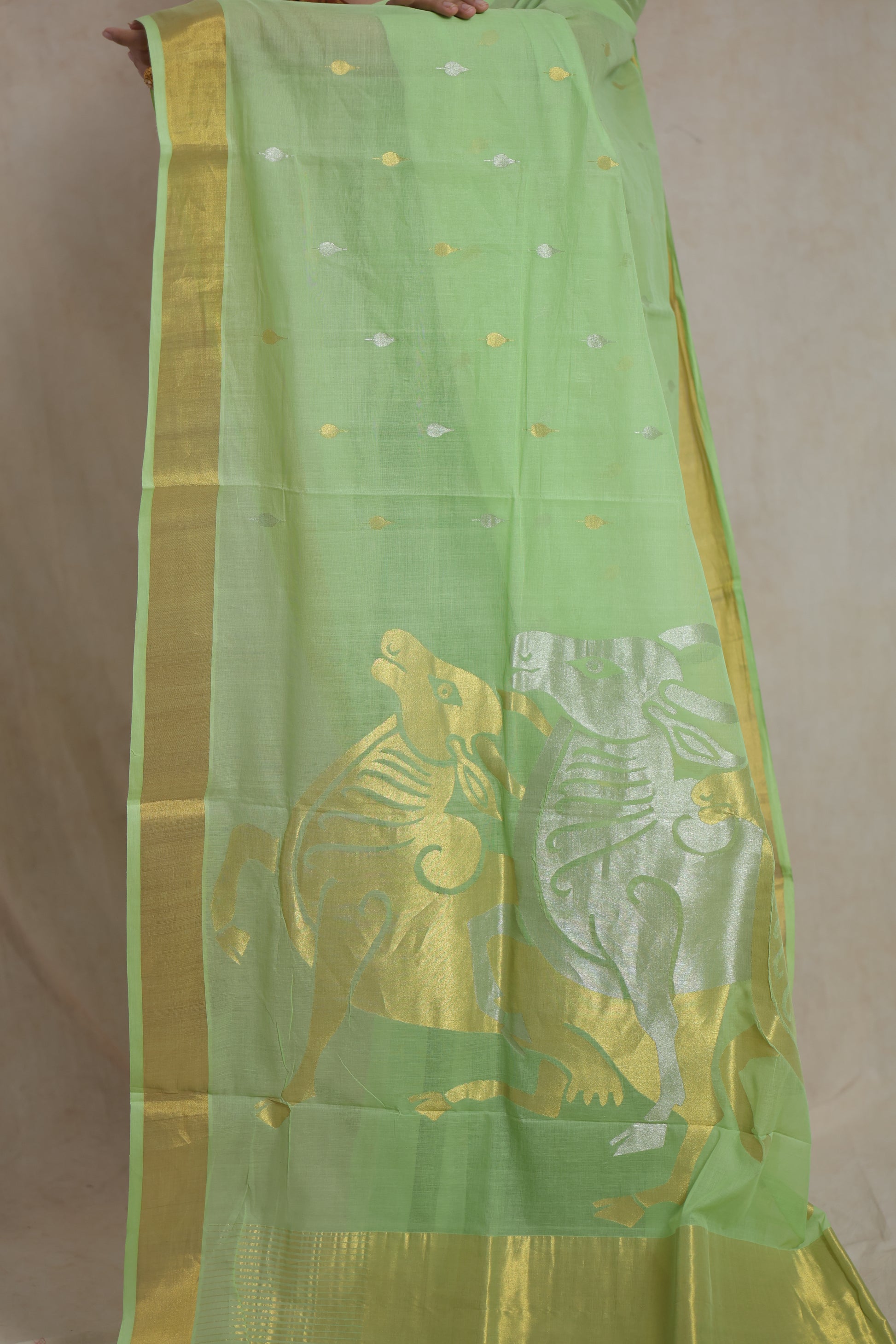 Traditional pallu of mint green Kanchipuram cotton saree featuring animal motifs