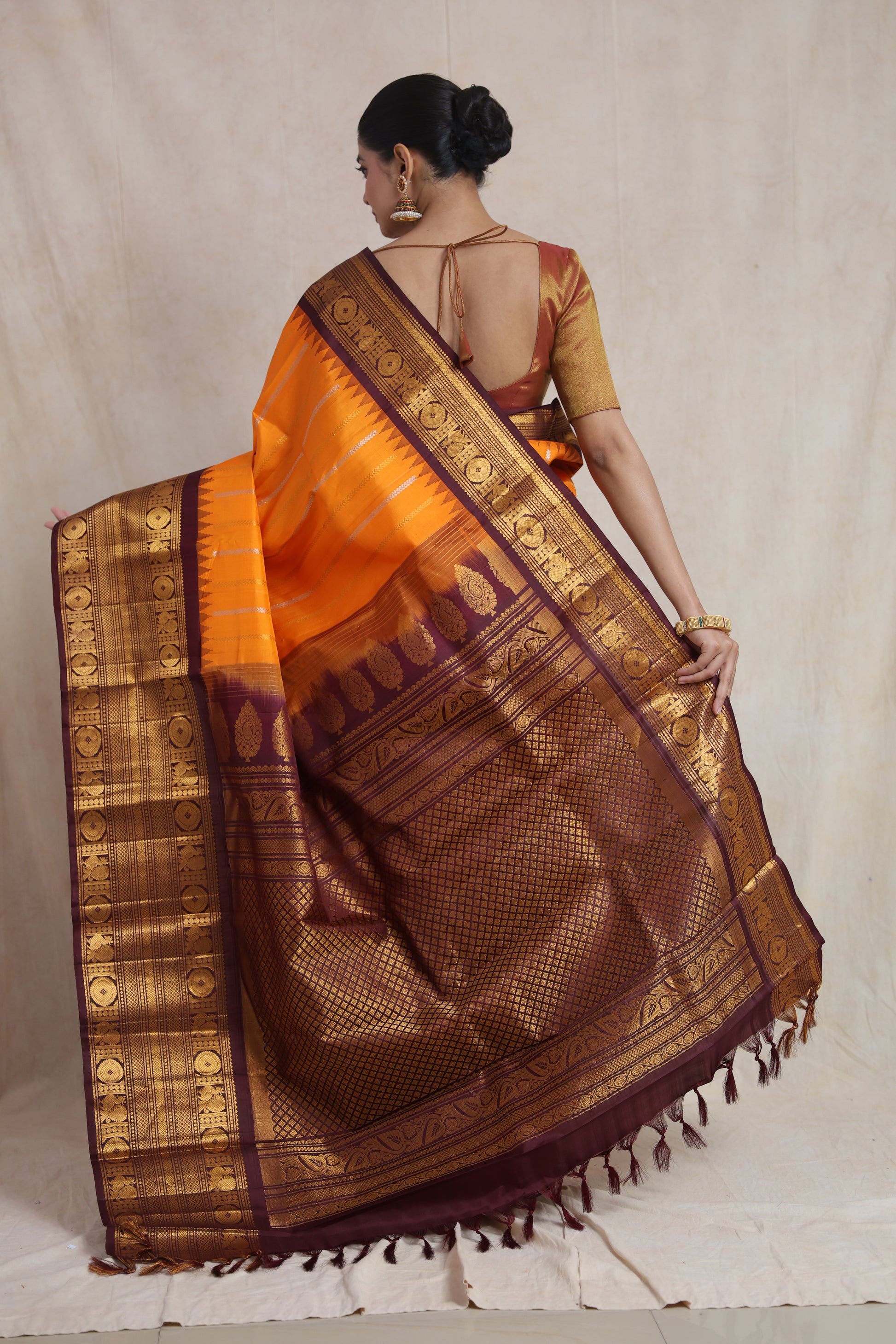 Back view of the Gadwal silk saree highlighting its intricately woven pallu and broad contrast border.