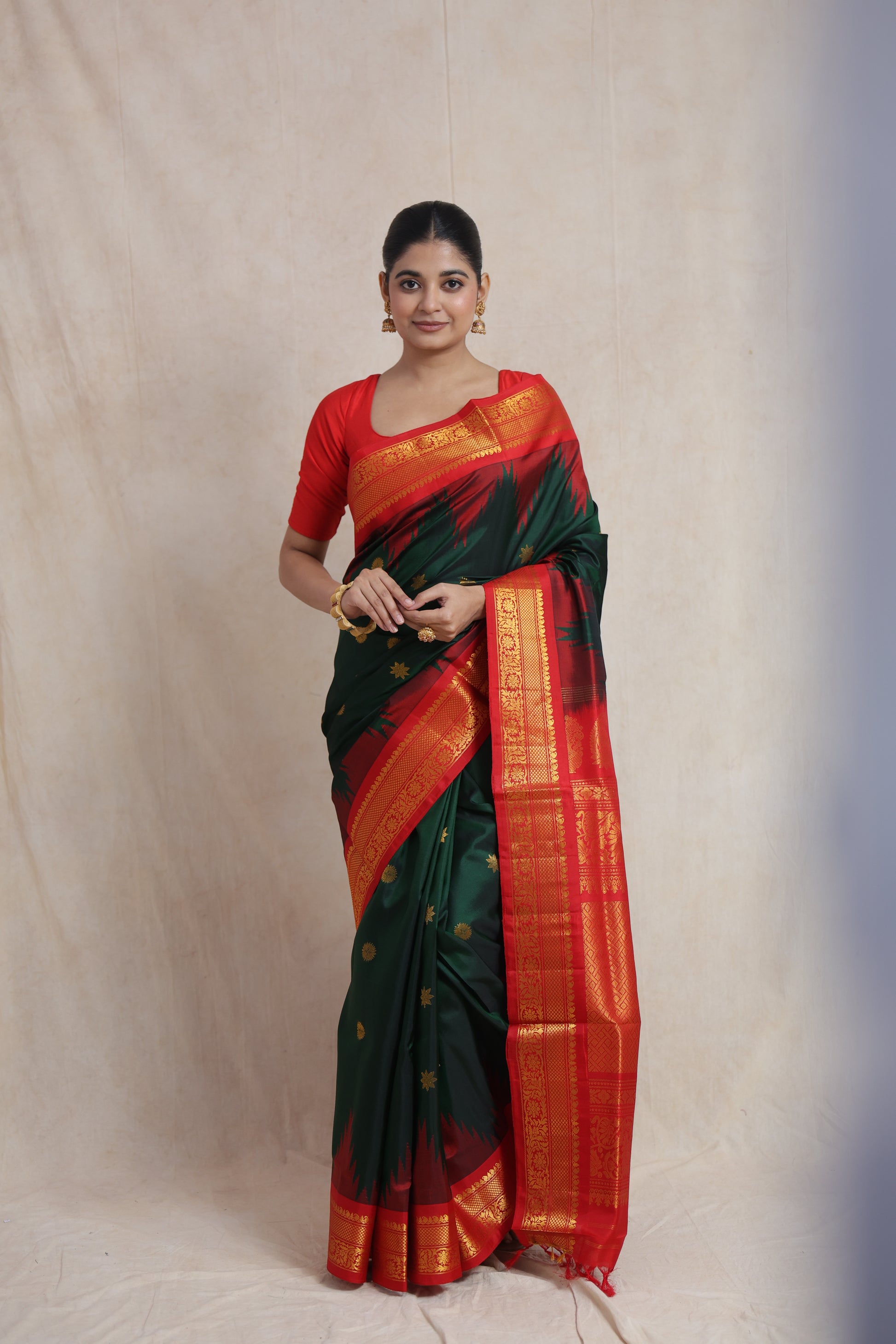 Forest green Gadwal silk saree with crimson red border and traditional woven pallu