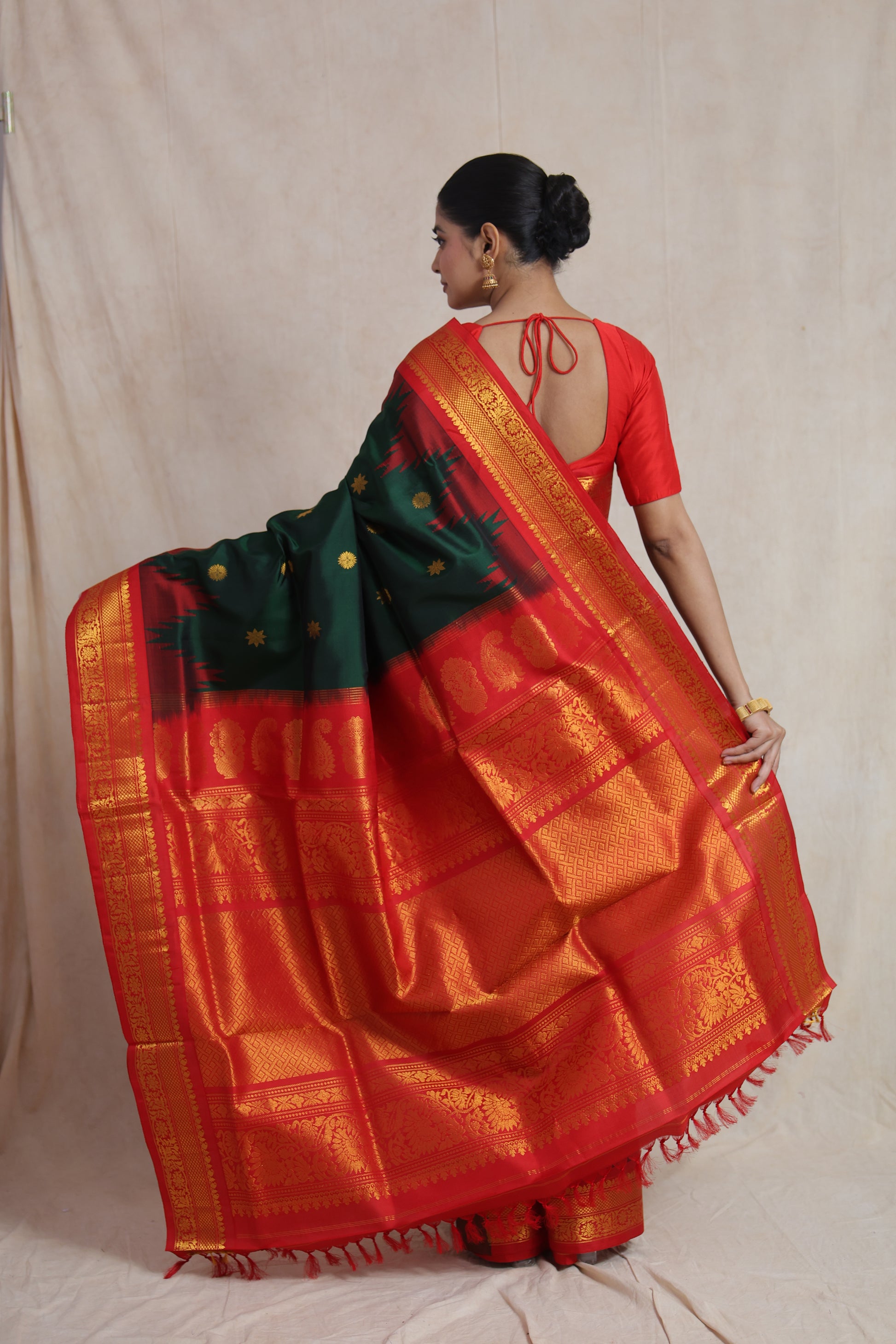 Forest green Gadwal silk saree with crimson red border and traditional woven pallu