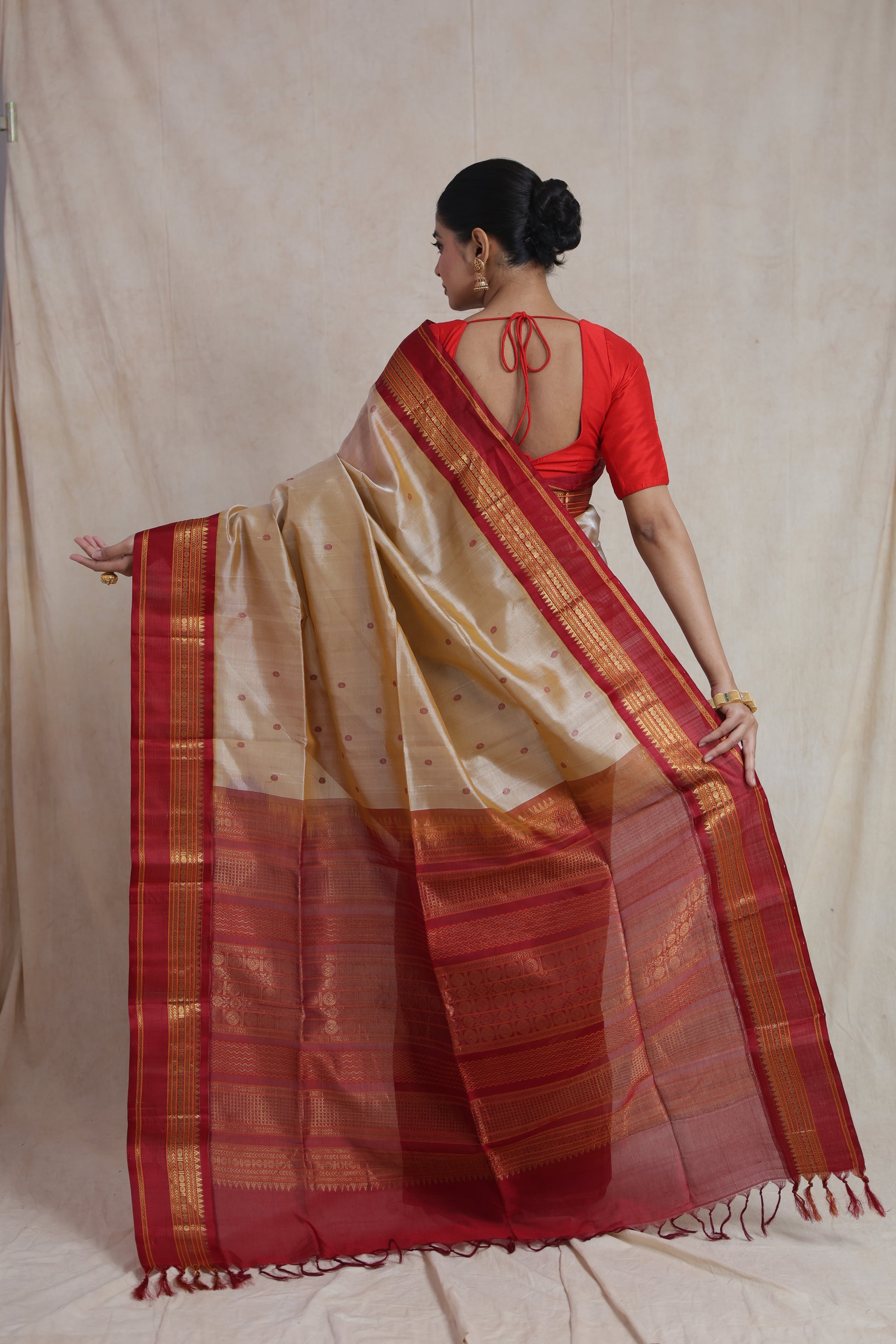 Back view showcasing the richly woven pallu of the beige Kanchipuram Handloom SICO saree