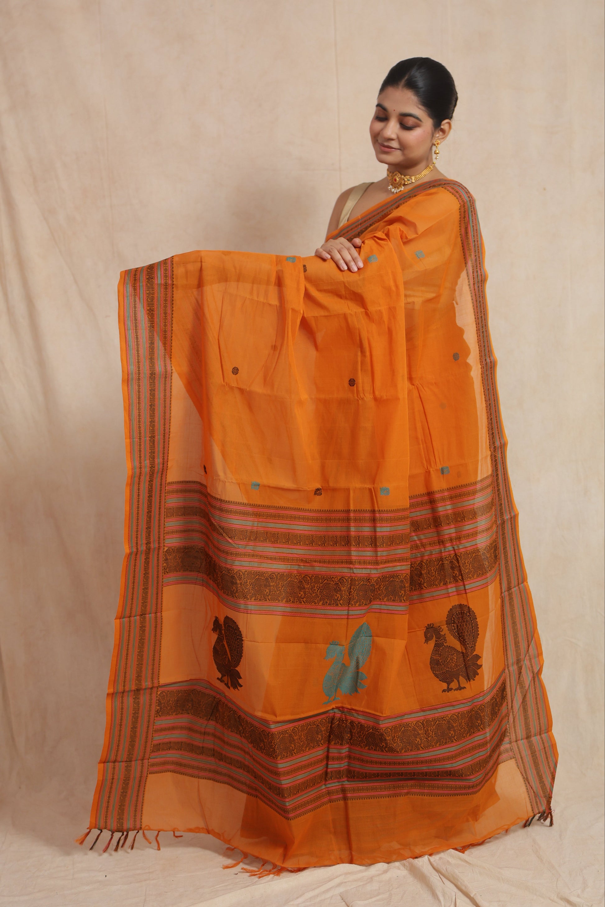 Kanchipuram handloom cotton saree with decorative peacock motifs and woven pallu design