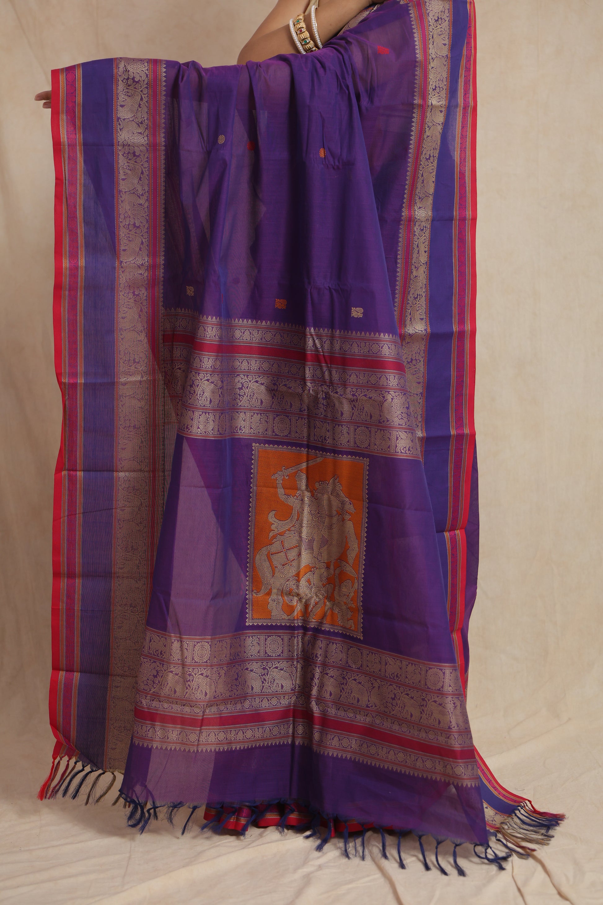 Royal purple Kanchipuram cotton saree showcasing delicate woven buttas and contrast pink border