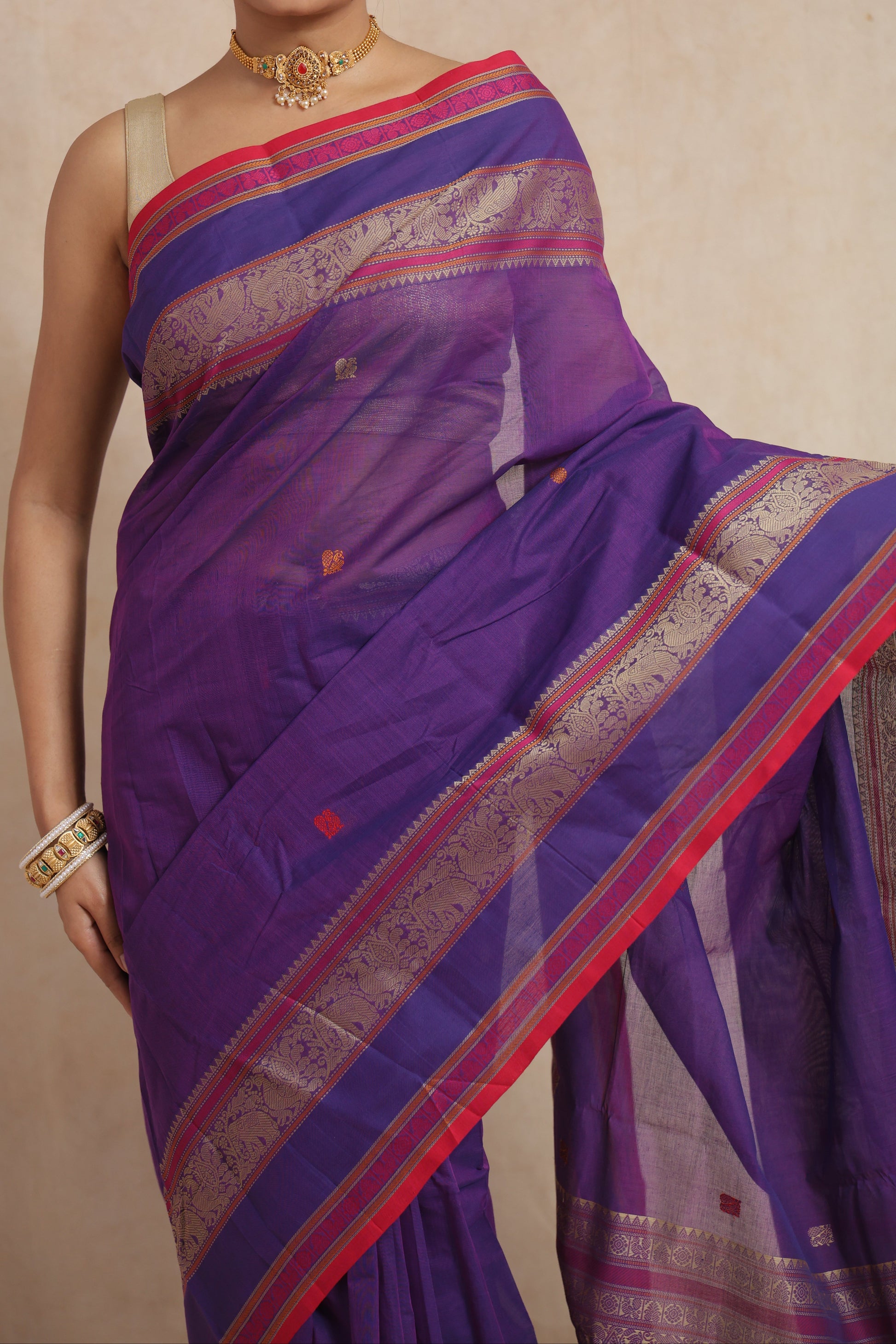 Detailed pallu view of royal purple handloom cotton saree with ornate woven craftsmanship