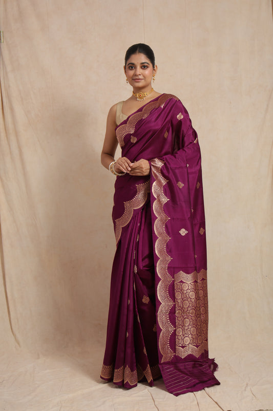 Full front view of royal magenta Banarasi art silk saree with woven buttas and scalloped border