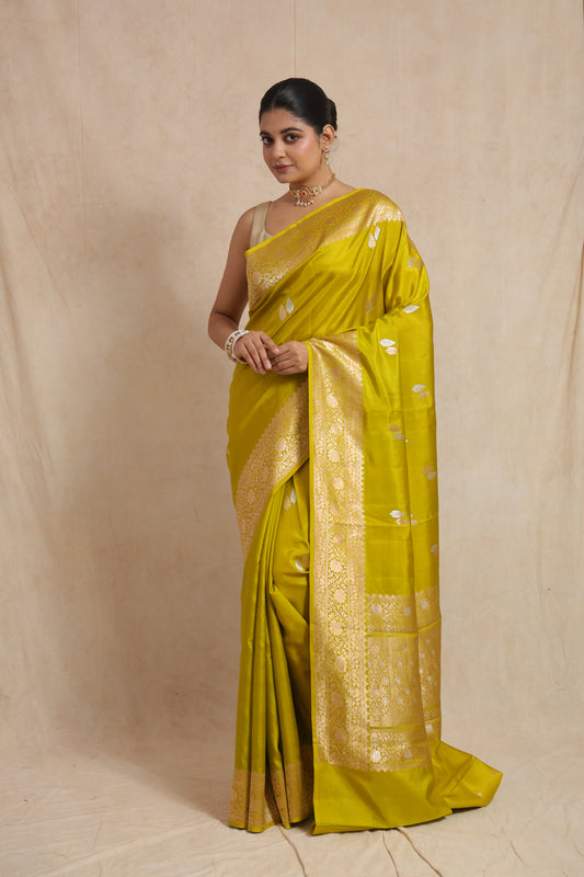 Full front view of lime yellow Banarasi silk saree with rich woven border