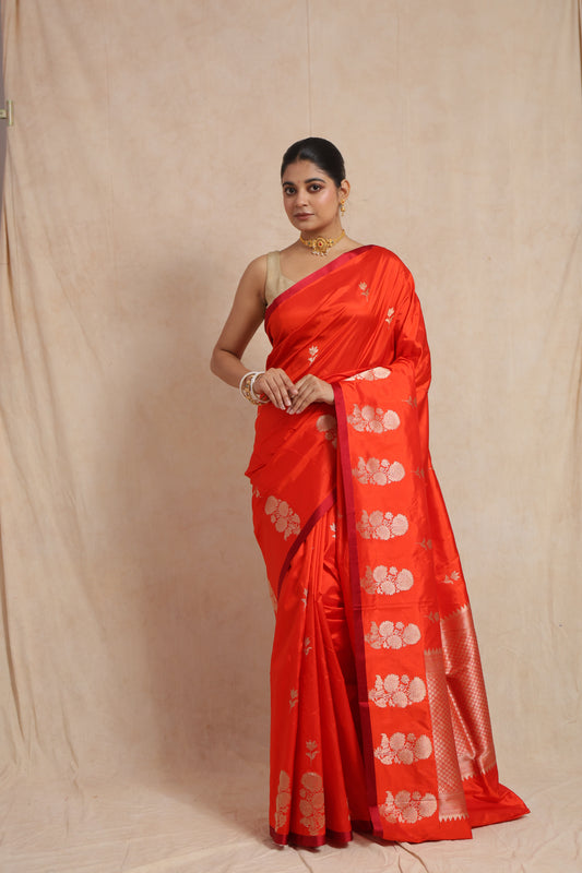 Full front view of vibrant vermilion Banarasi silk saree with traditional woven pallu