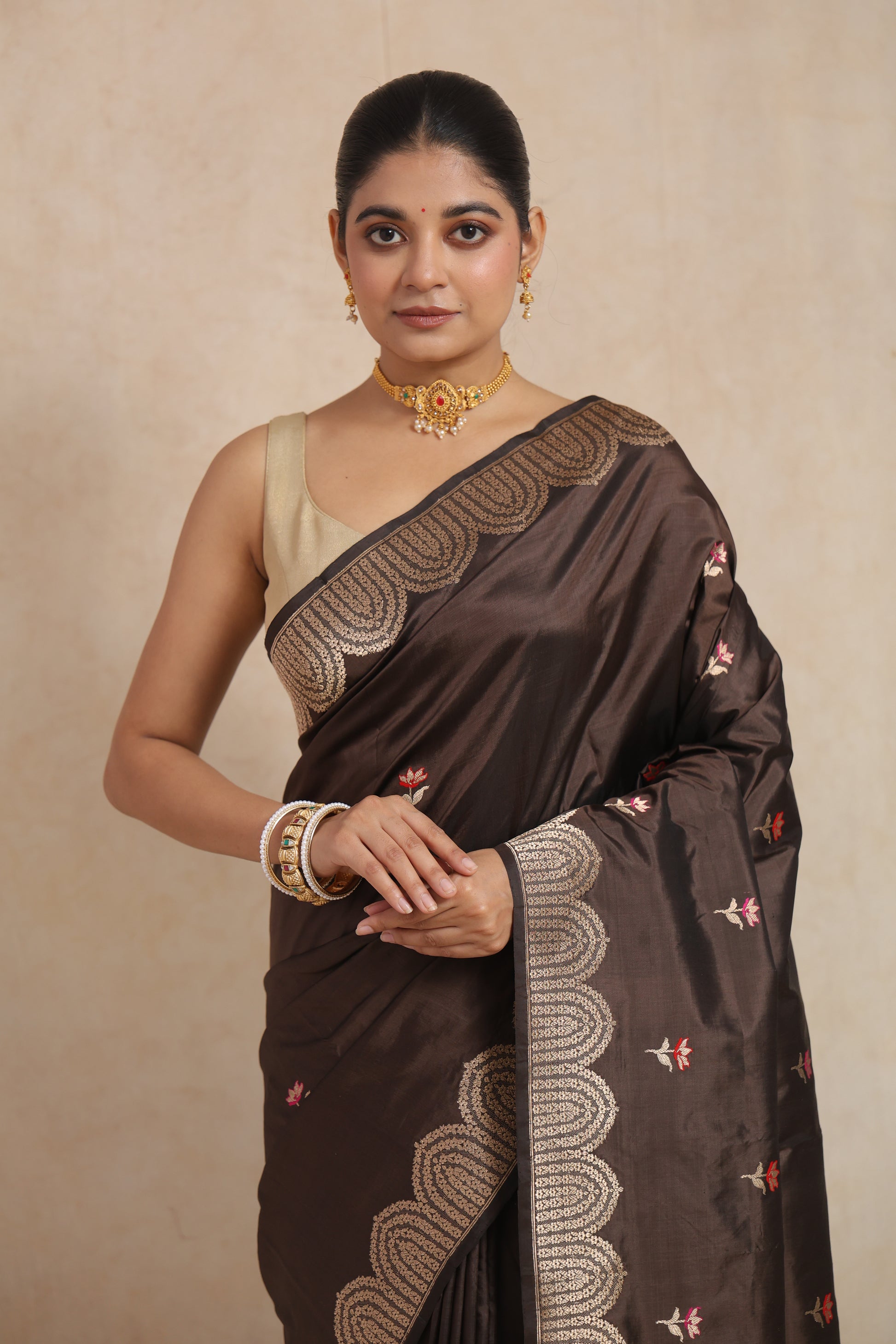 Portrait view of espresso brown Banarasi art silk saree highlighting the rich border and luxurious drape