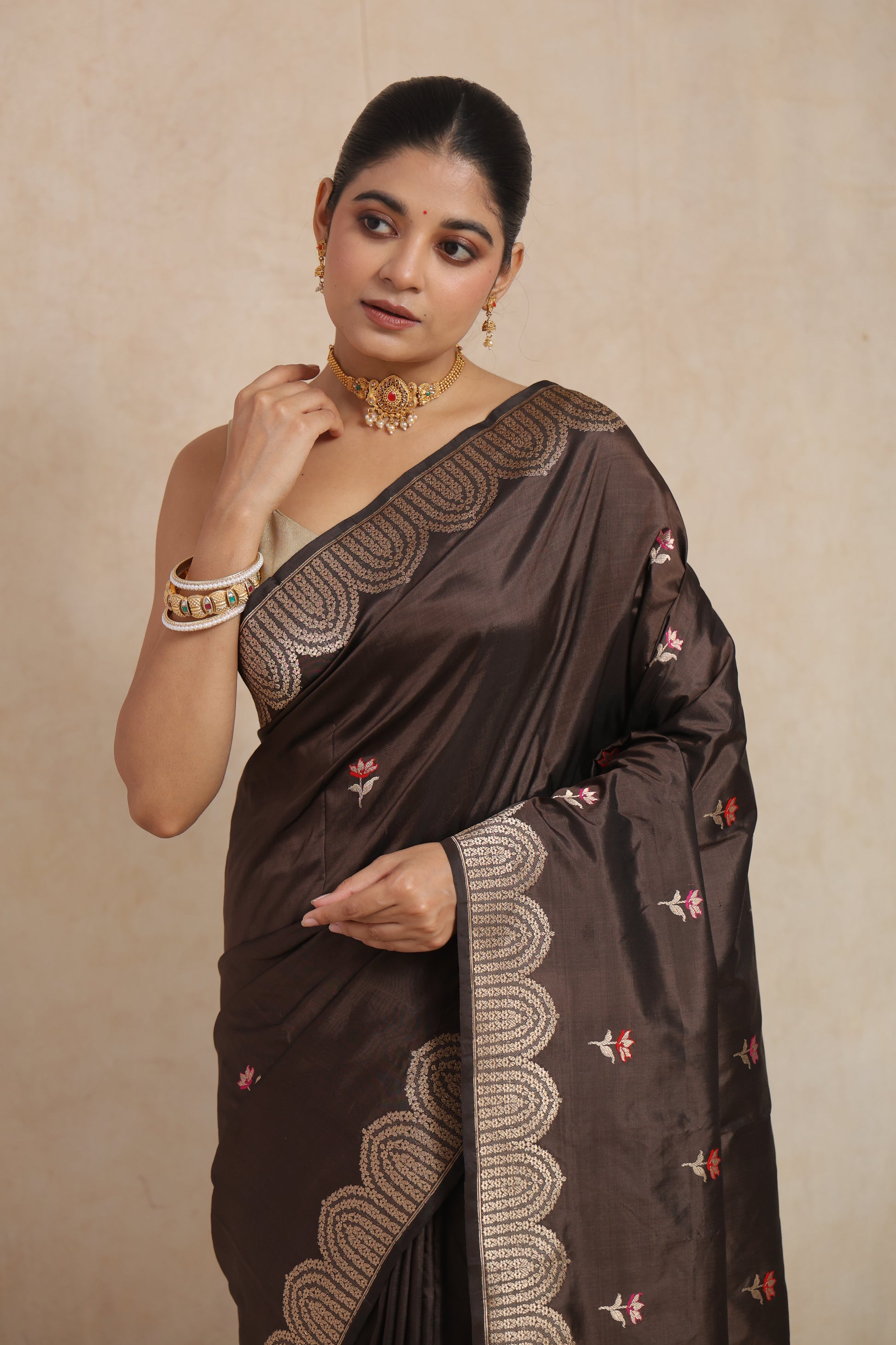 Fashion portrait of espresso brown Banarasi art silk saree with delicate floral buttas and heritage-inspired border