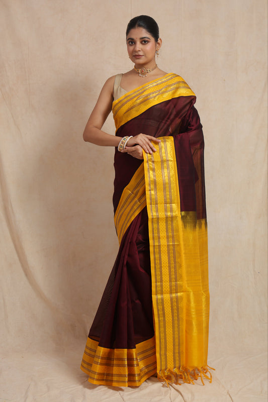 Front view of royal maroon Kanchipuram Handloom SICO saree with golden yellow traditional woven border