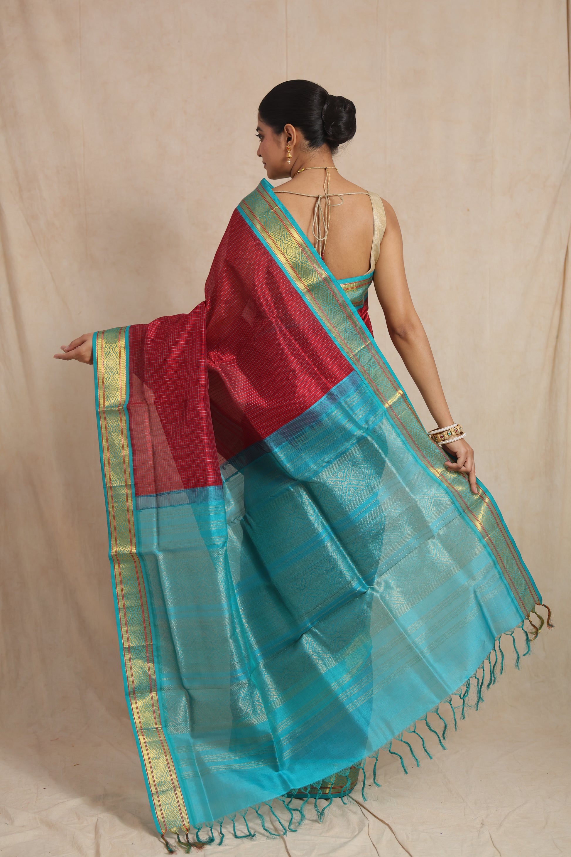 Back view highlighting the contrasting aqua blue pallu of the Kanchipuram SICO saree