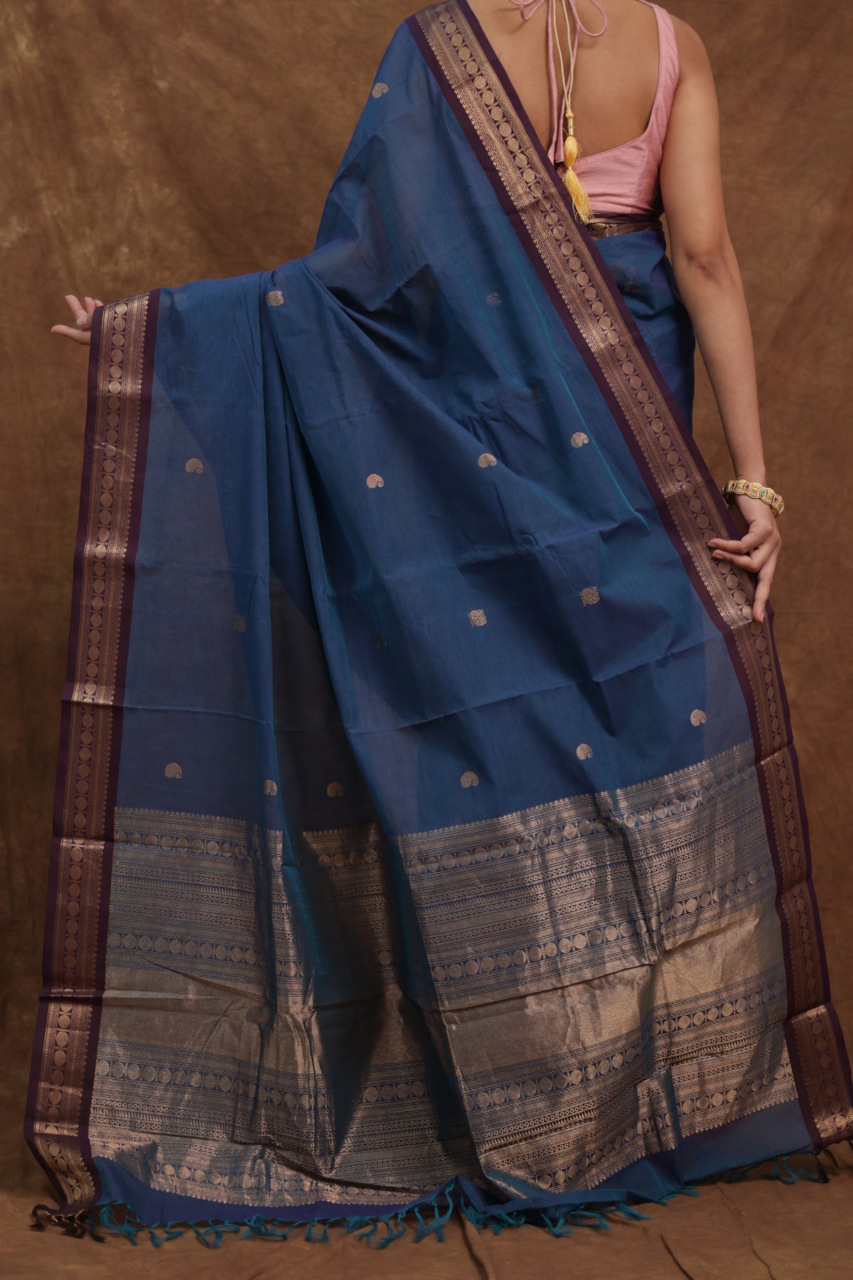 Blue Kanchipuram cotton saree with rust woven border, traditional denim blue sari from Joyee Kolkata, detailed woven design.