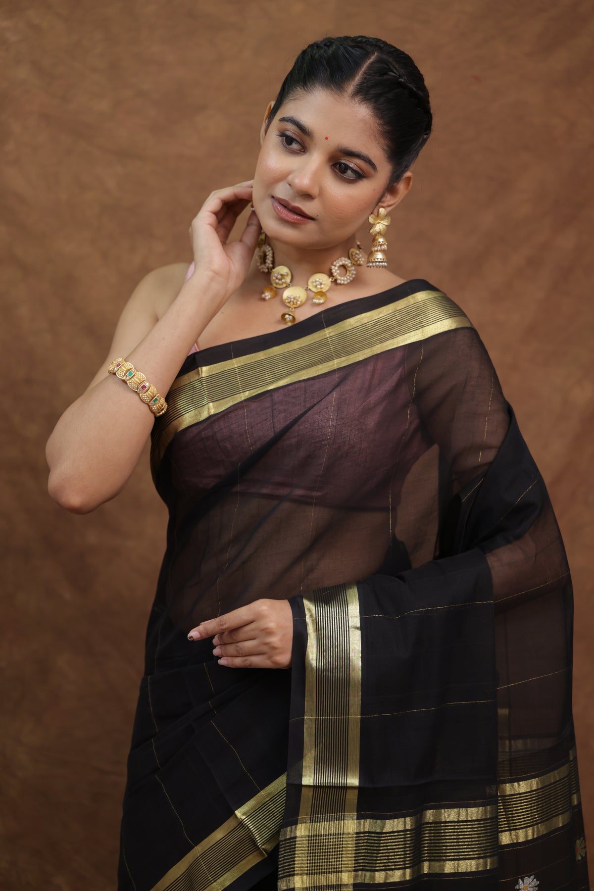 Elegant black Kanchipuram cotton saree with olive green border, traditional Indian sari by Joyee Kolkata.