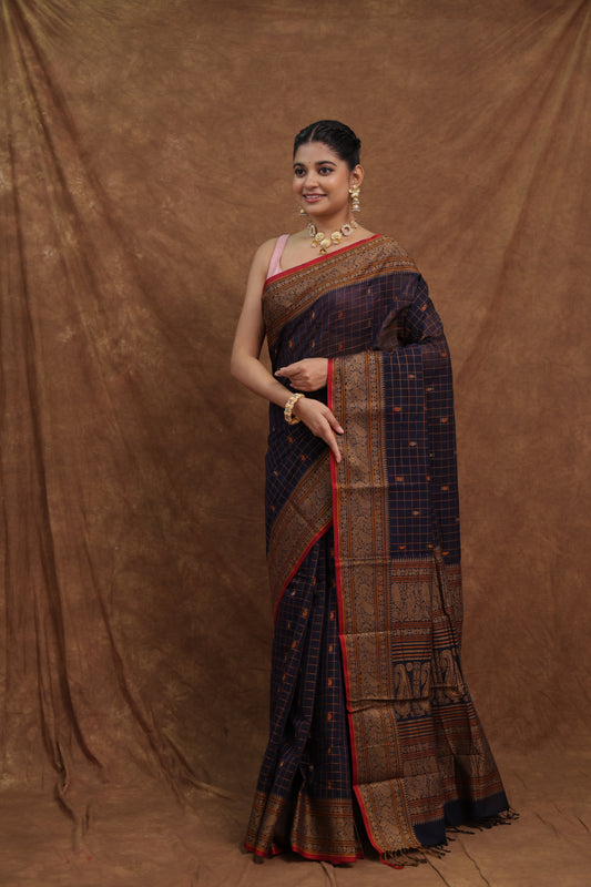 Deep navy Kanchipuram cotton saree with rust red woven border, traditional Indian sari from Joyee Kolkata.