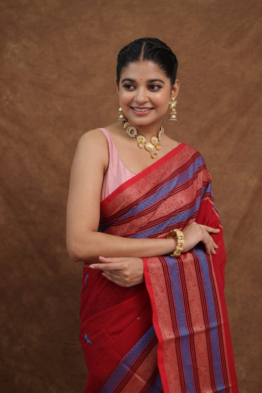 Crimson red Kanchipuram SICO saree with navy blue striped pallu, traditional silk sari from Joyee Kolkata.