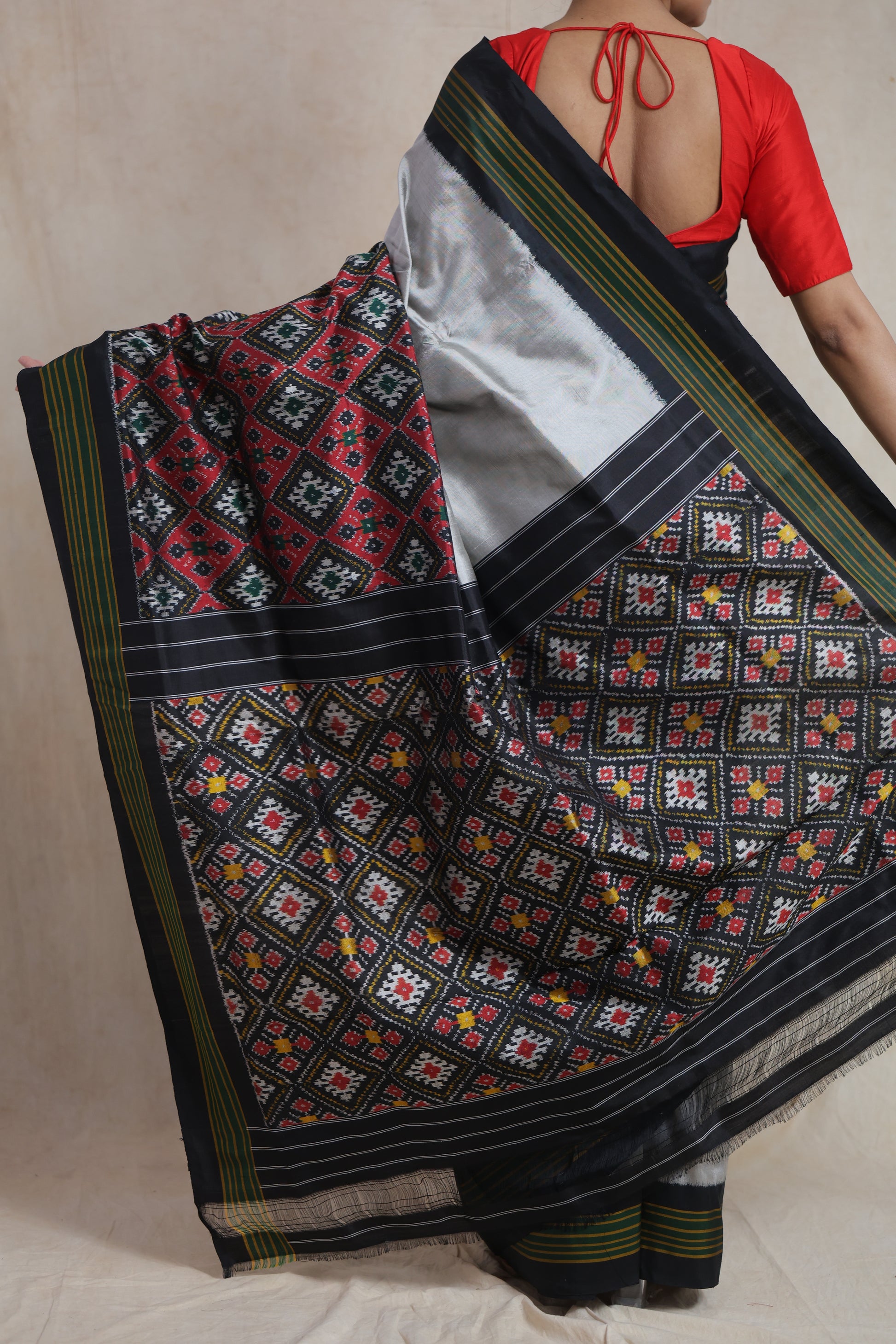 Back view of Panchampali handloom silk saree showcasing traditional ikat woven pallu and silver detailing