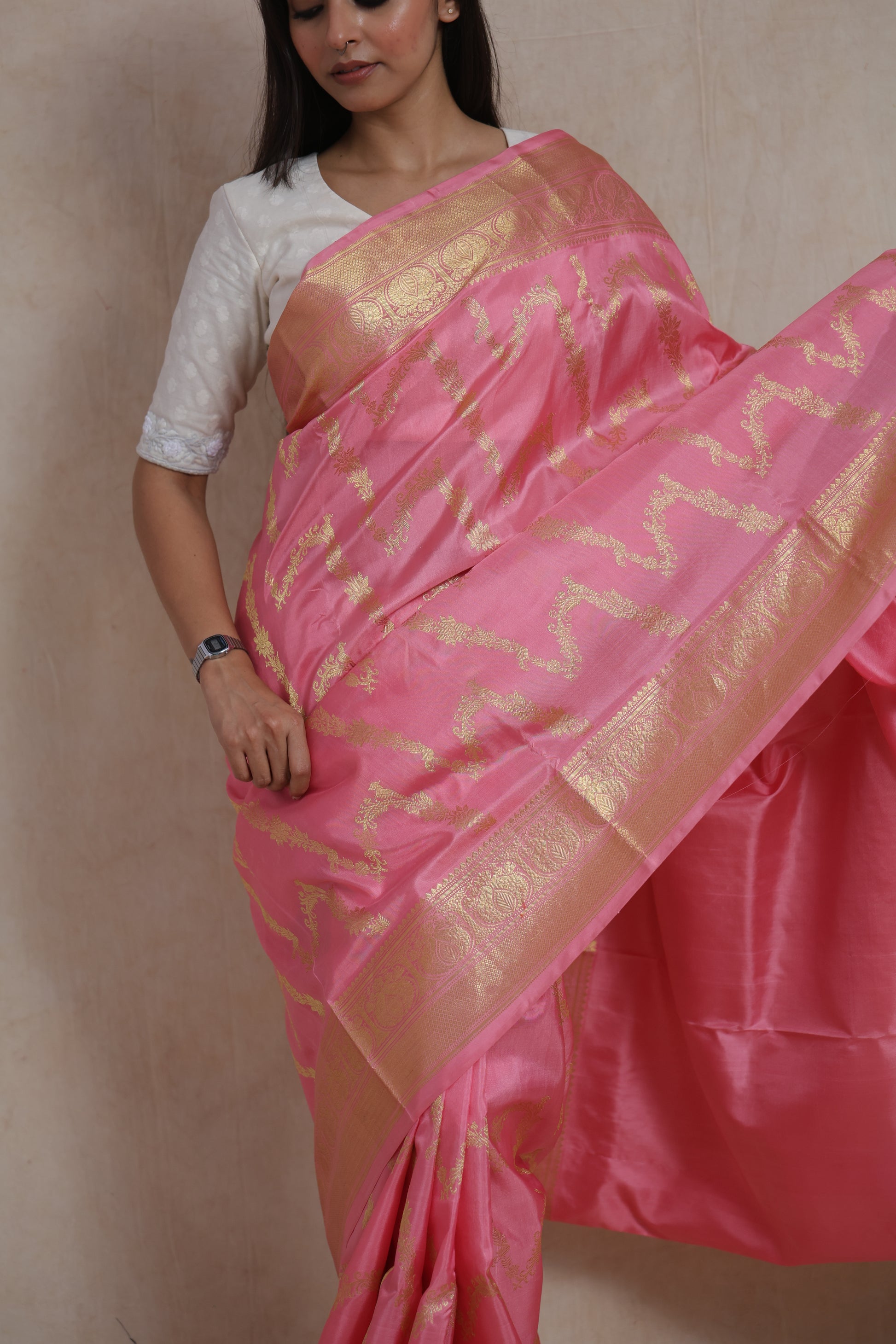 Detailed drape view of blush pink Kanchipuram silk saree with traditional motifs
