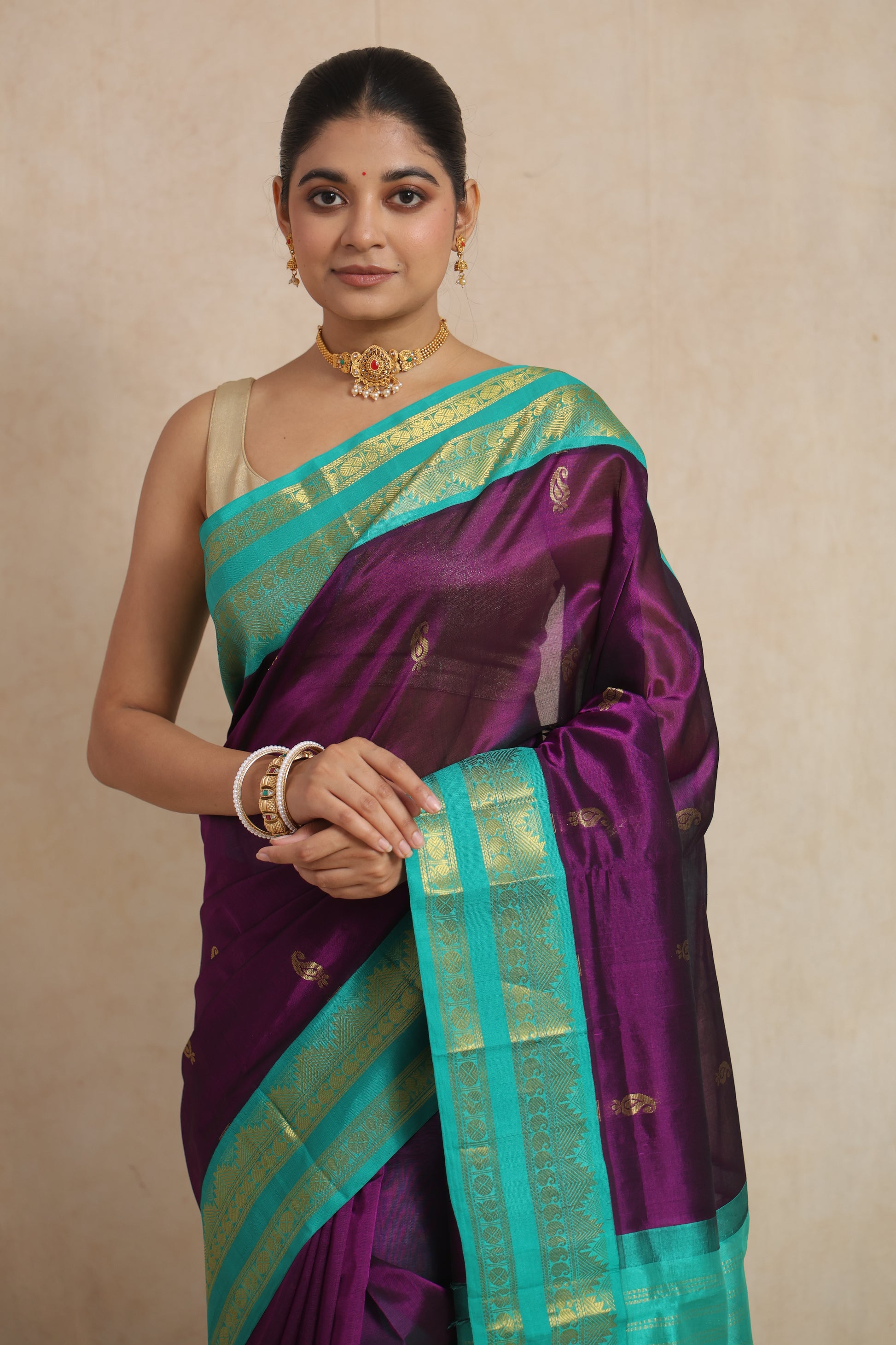 Close-up of royal purple Kanchipuram Sico saree with woven zari border and buttas