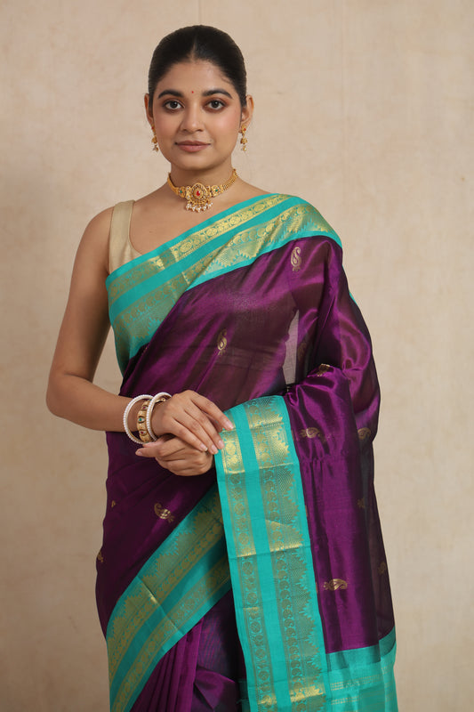 Close-up of royal purple Kanchipuram Sico saree with woven zari border and buttas