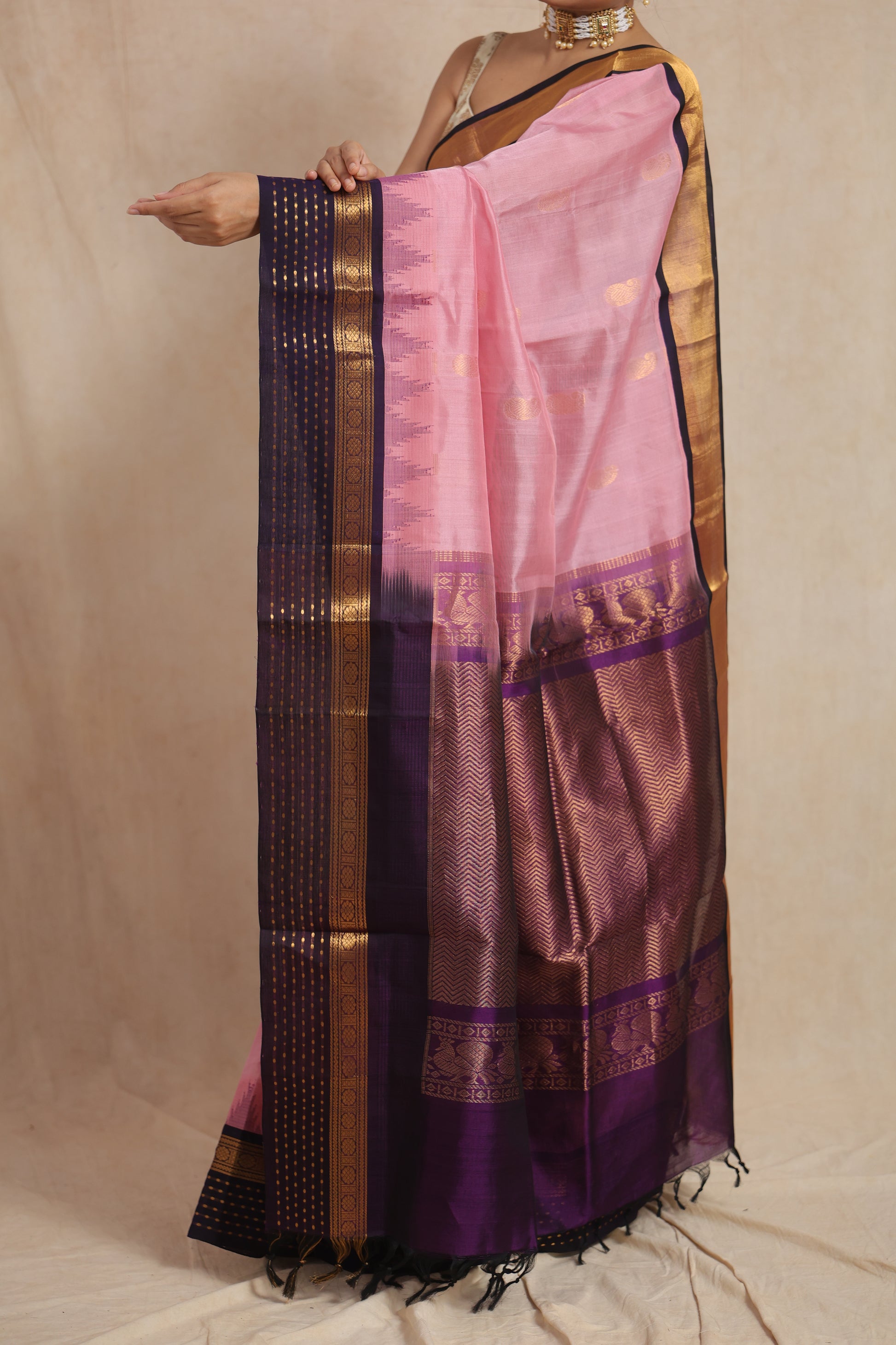 Detailed pallu view of blush pink Kanchipuram Sico saree with zari woven border