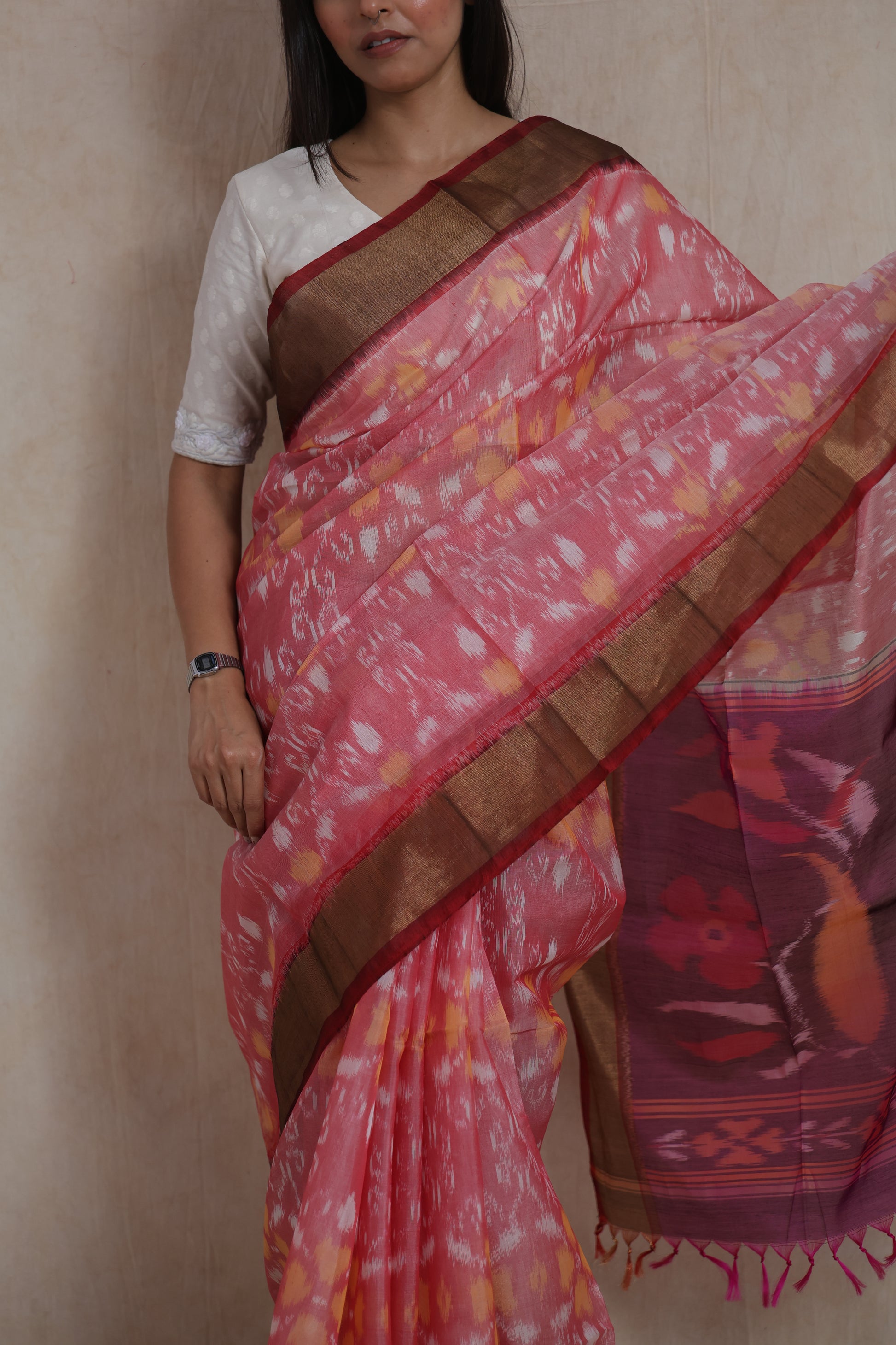 Drape close-up of pink Pochampally silk cotton saree with intricate Ikat motifs and Saree view