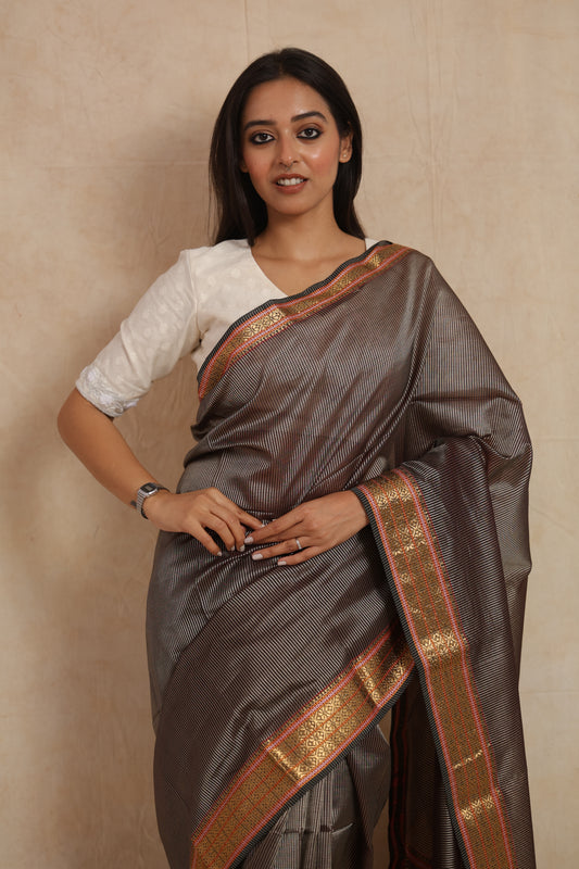 Elegant charcoal grey Maheshwari silk cotton saree with rich woven pallu