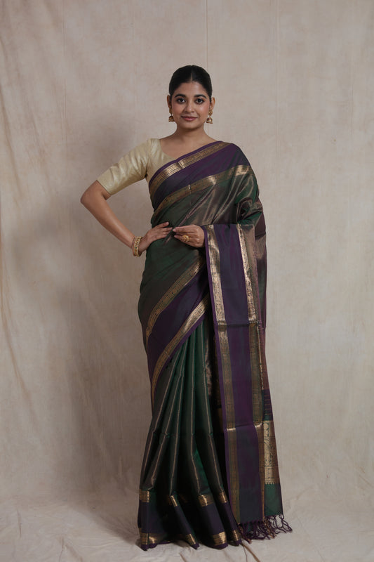 Full front view of emerald green and purple Kanchipuram silk saree