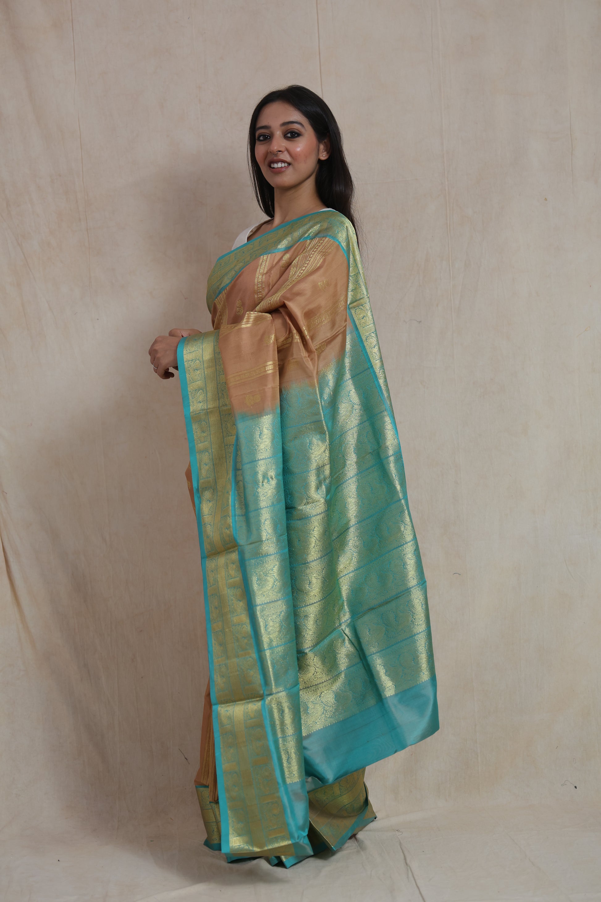 Side profile of Venkatagiri silk saree showcasing rich aqua blue pallu and traditional woven craftsmanship