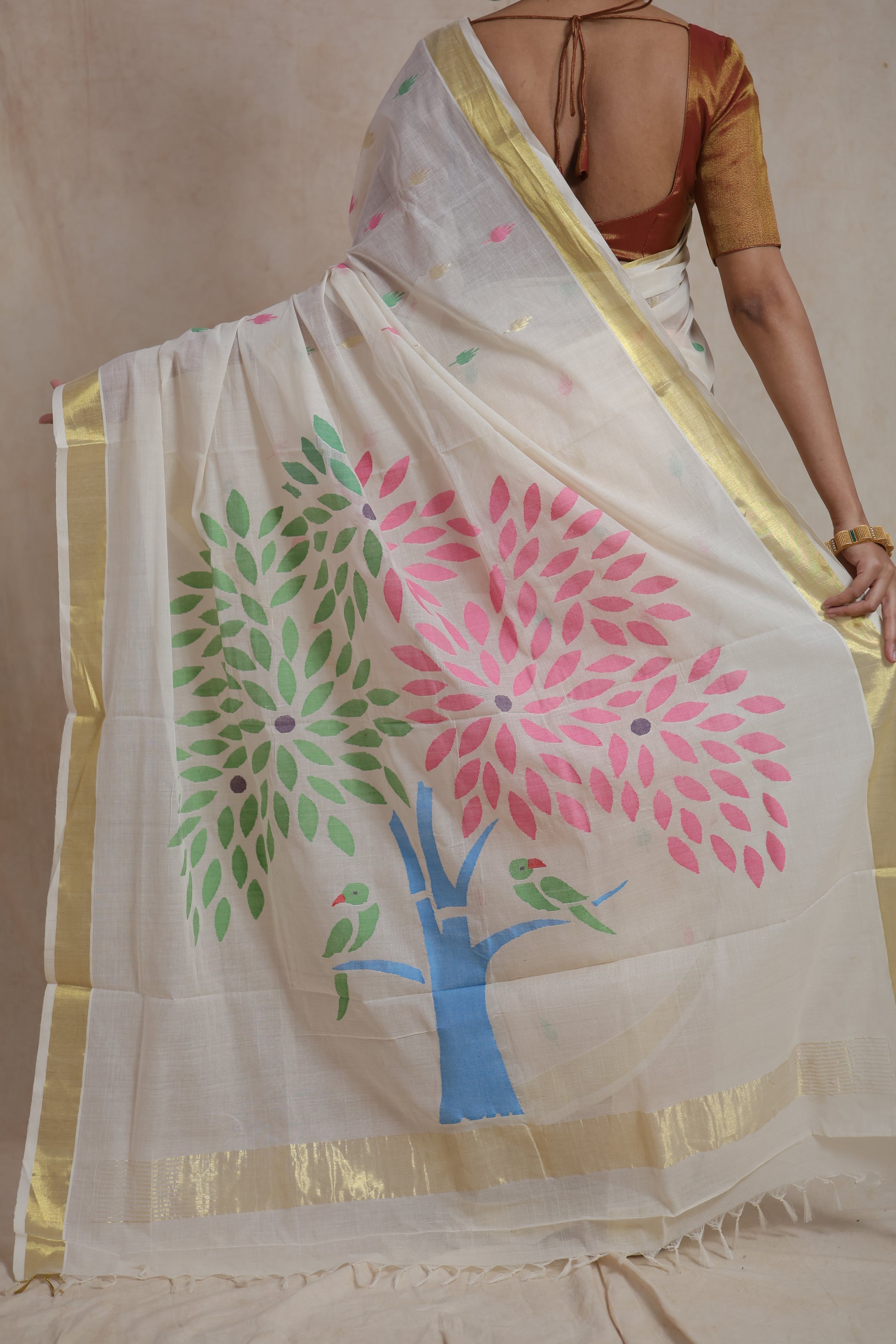 Detailed artistic pallu design with floral tree motifs on cotton saree