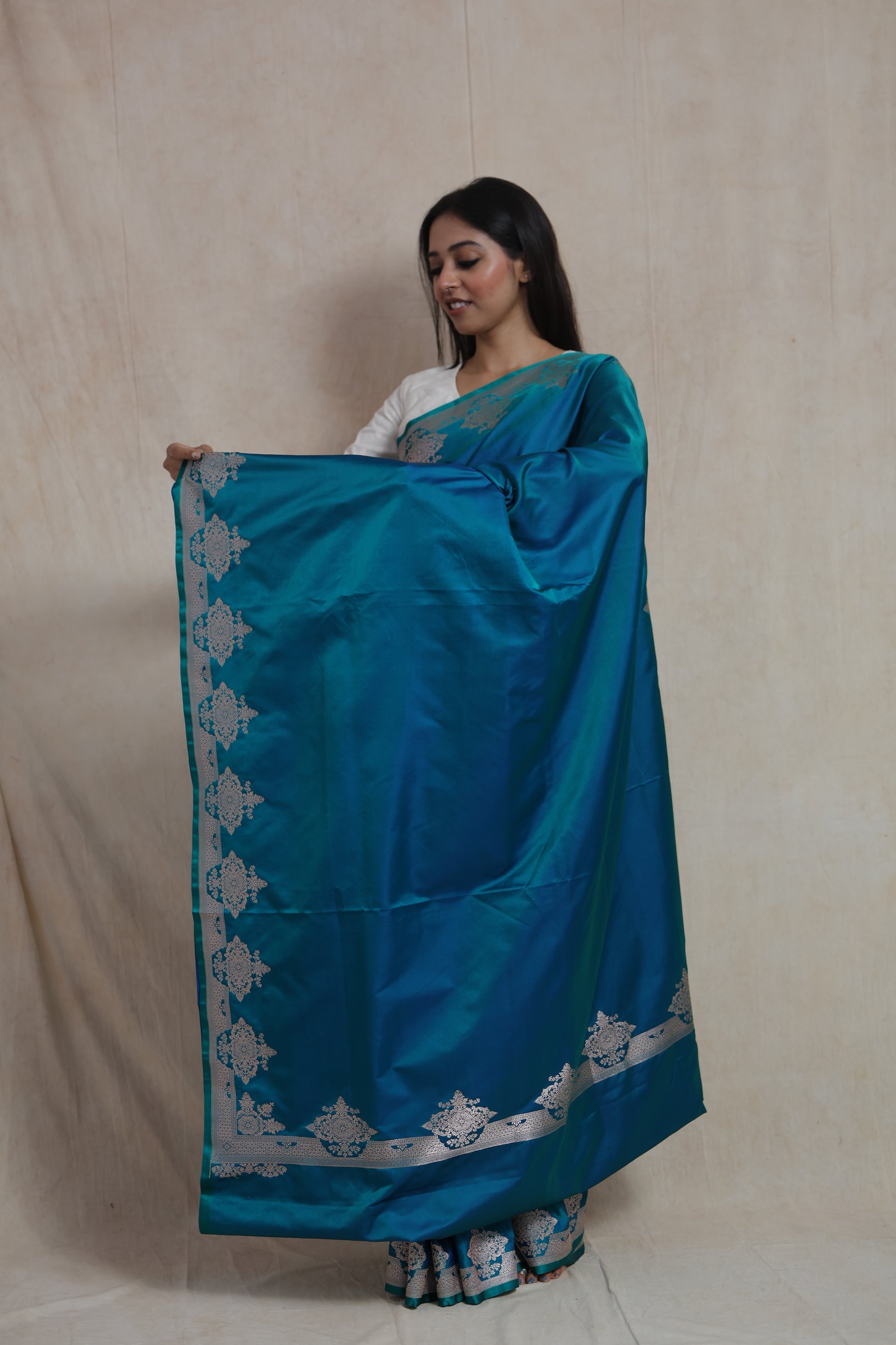 Full drape of teal blue Banarasi art silk saree with elegant silver zari work