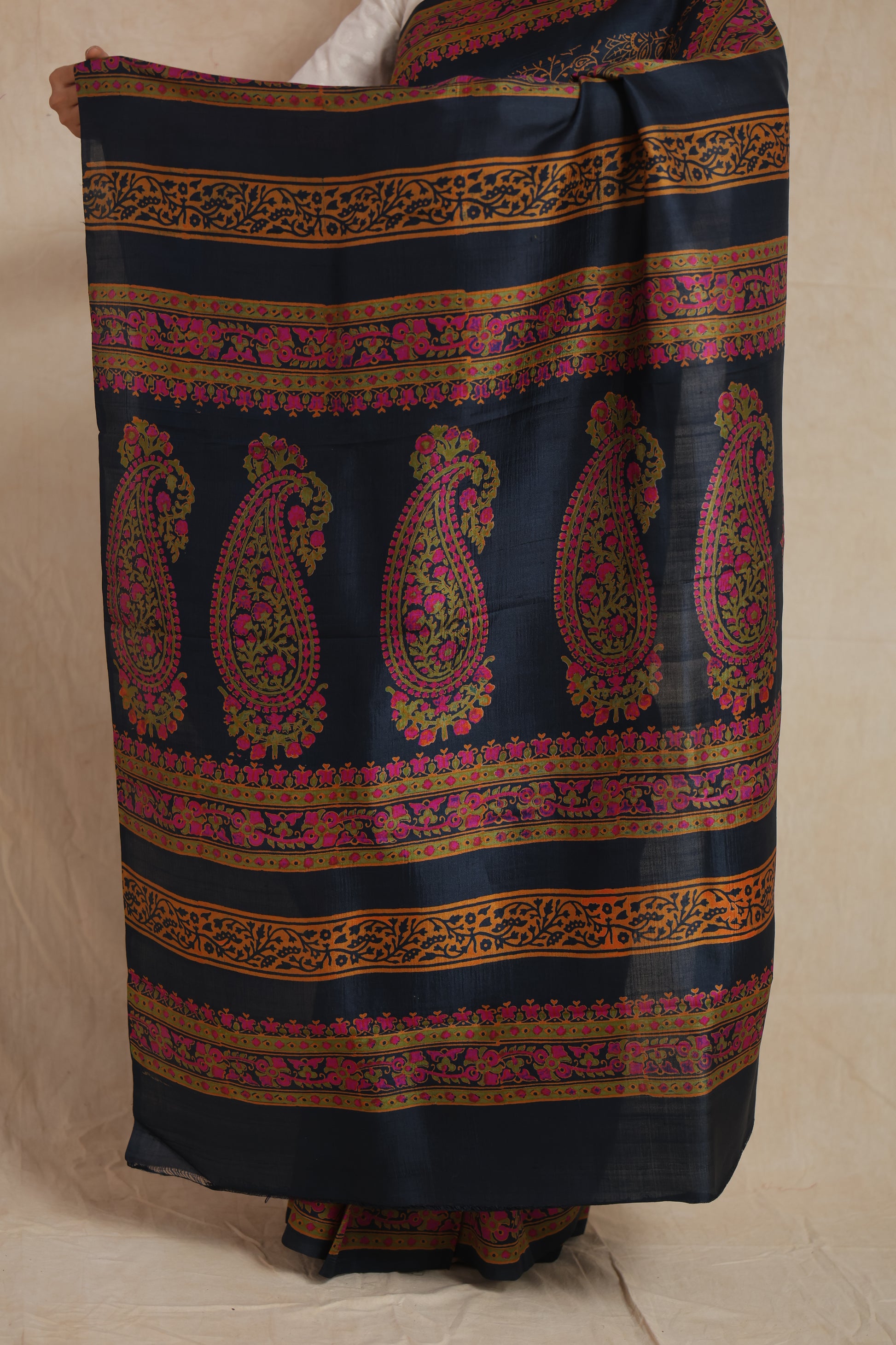 Detailed pallu design of navy blue Batik silk saree with paisley motifs