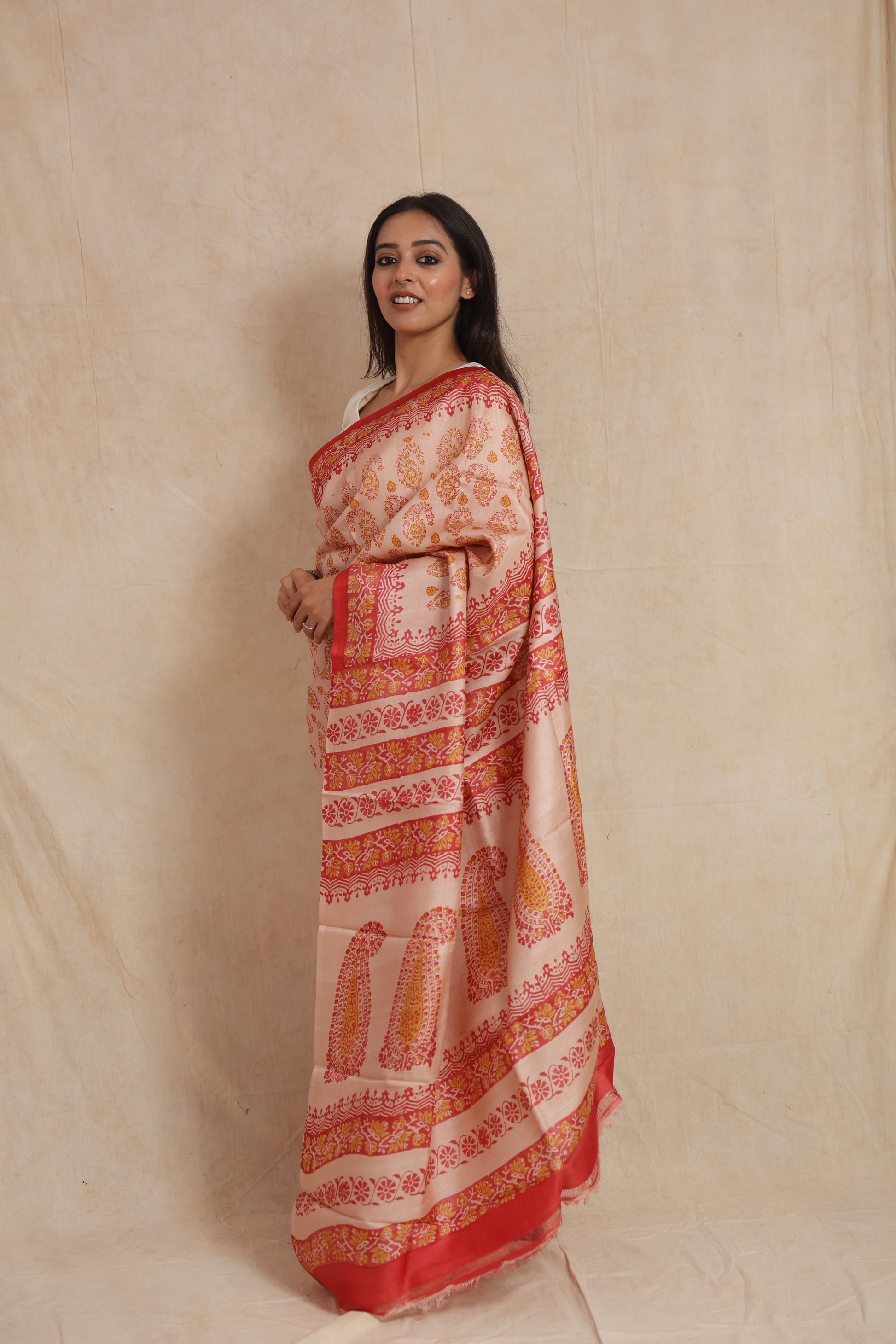 Side profile of blush pink Batik silk saree with intricate handcrafted-inspired motifs