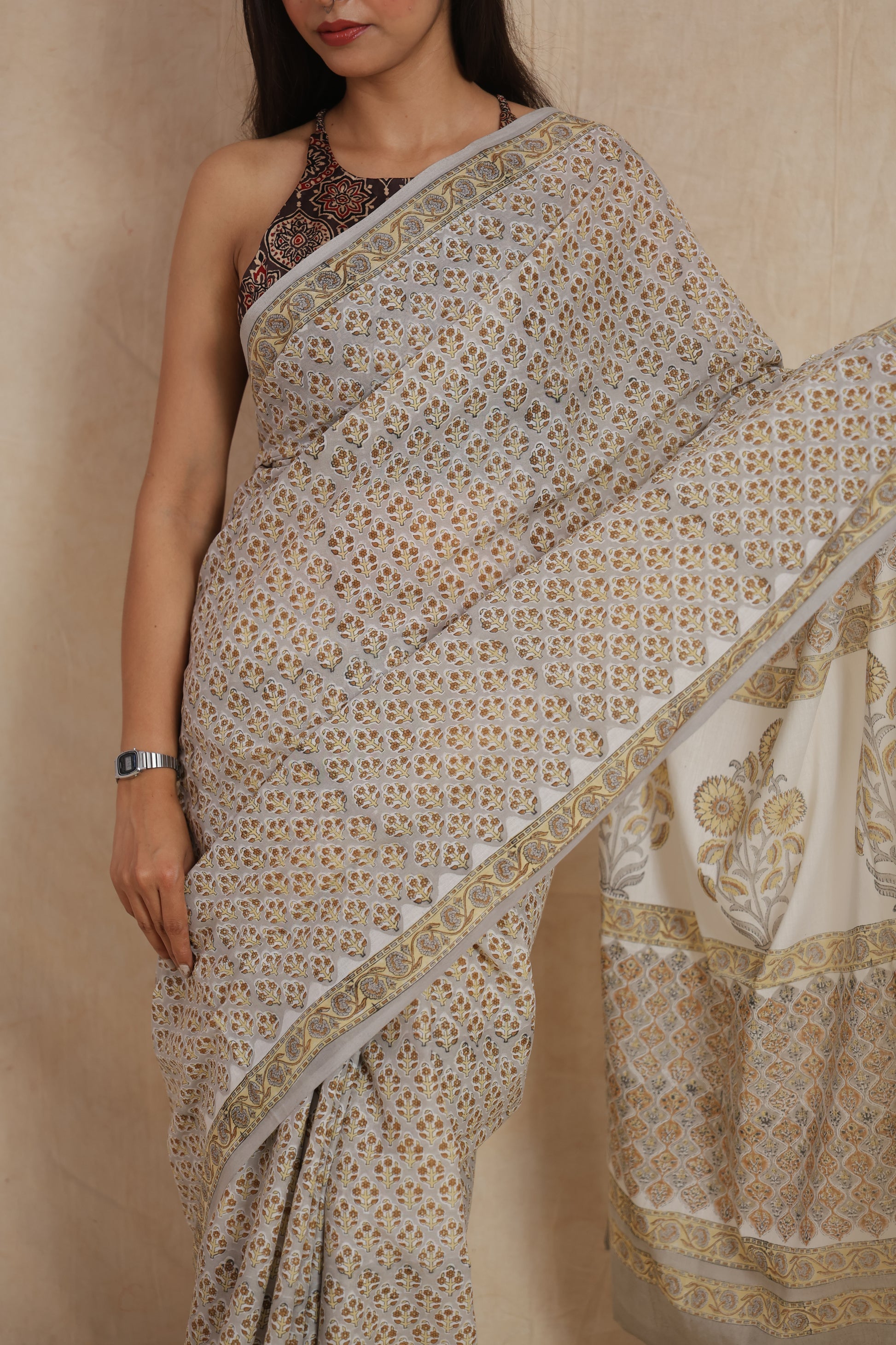 Closeup of floral handblock-inspired Sanghaneri cotton saree