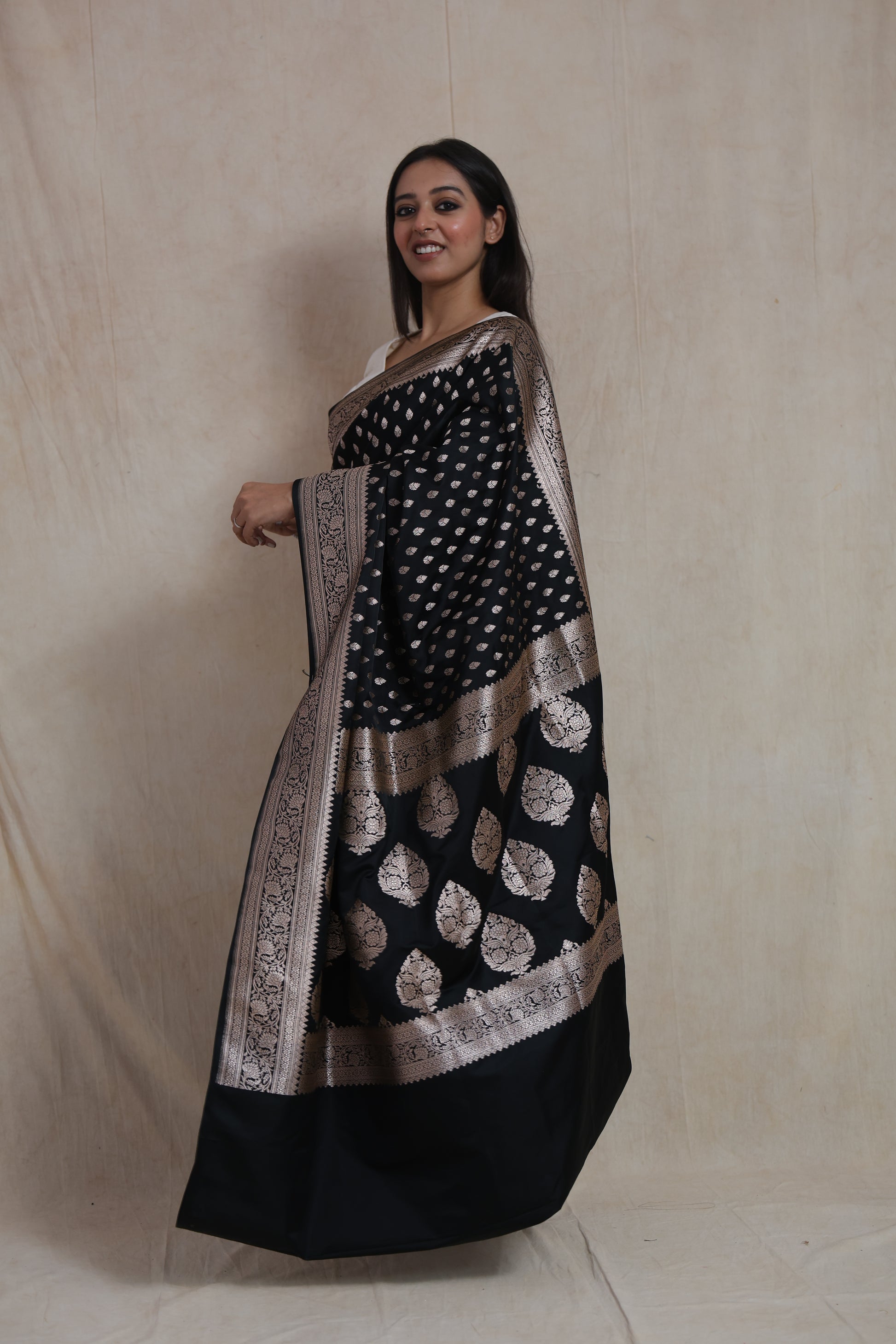 Side view of black Banarasi art silk saree featuring ornate woven border and rich pallu