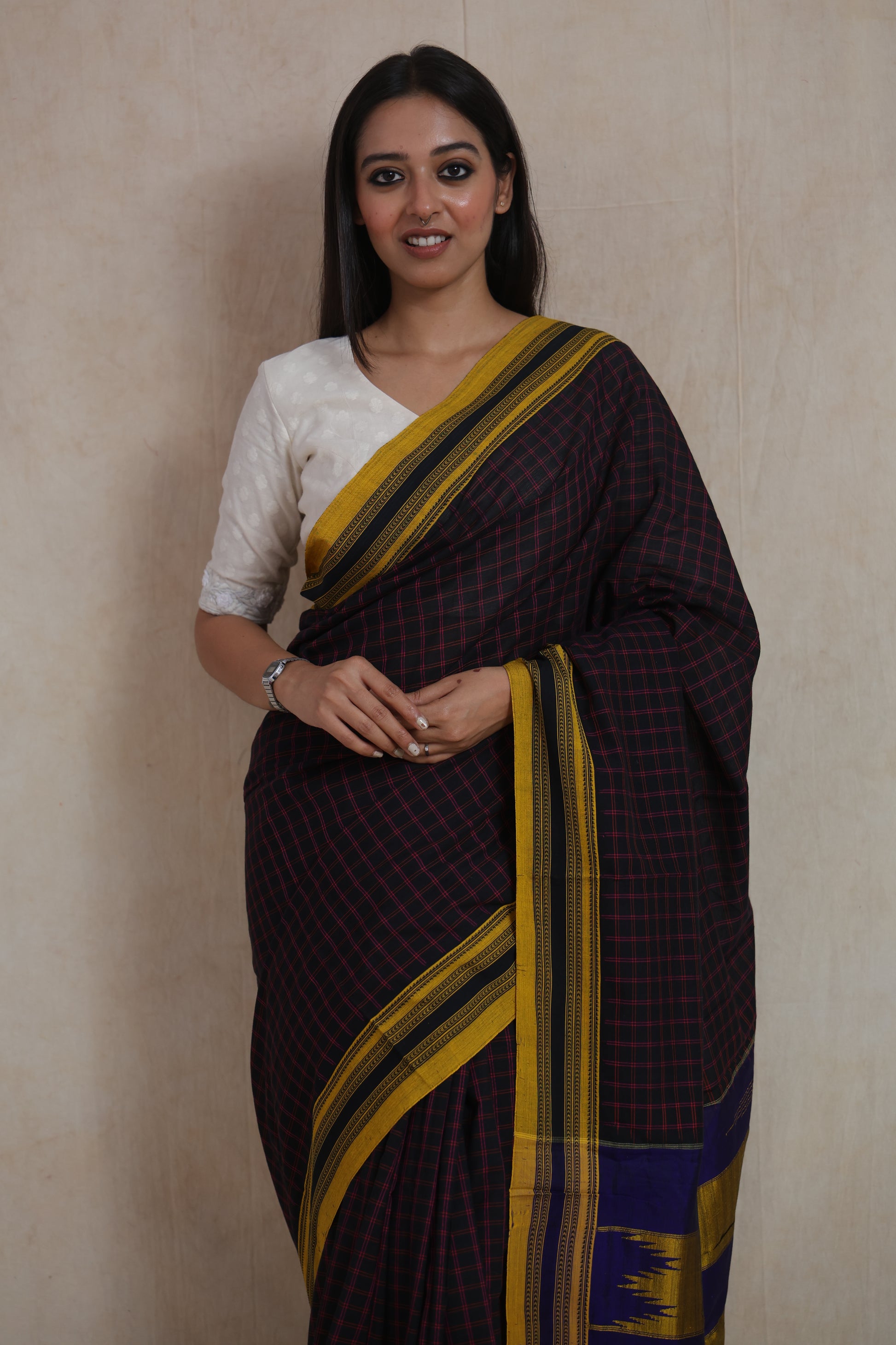 Black checked Ilak cotton saree with mustard border and royal blue woven pallu