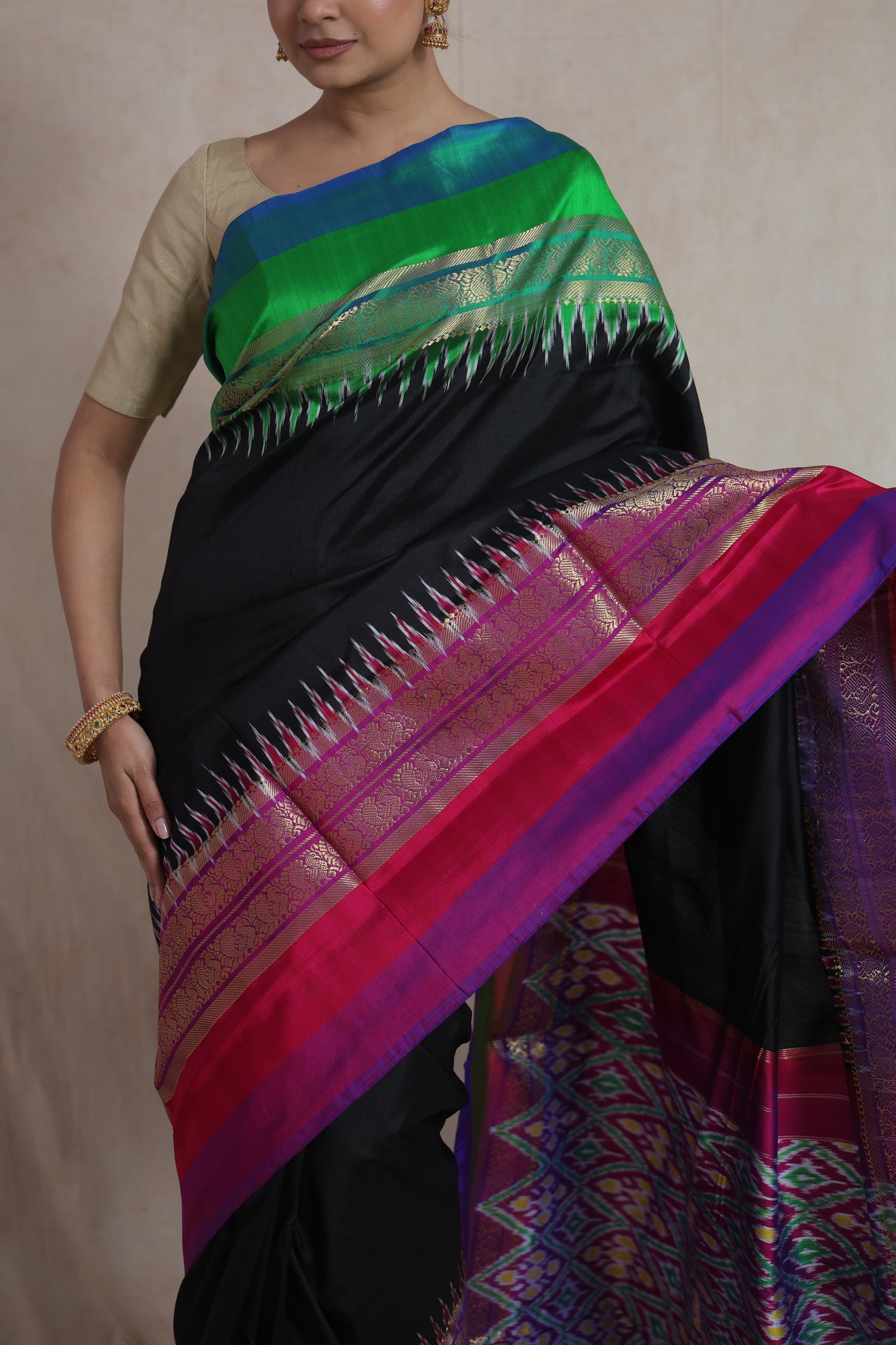 Close-up of black Panchampali silk saree with traditional woven Ikat border