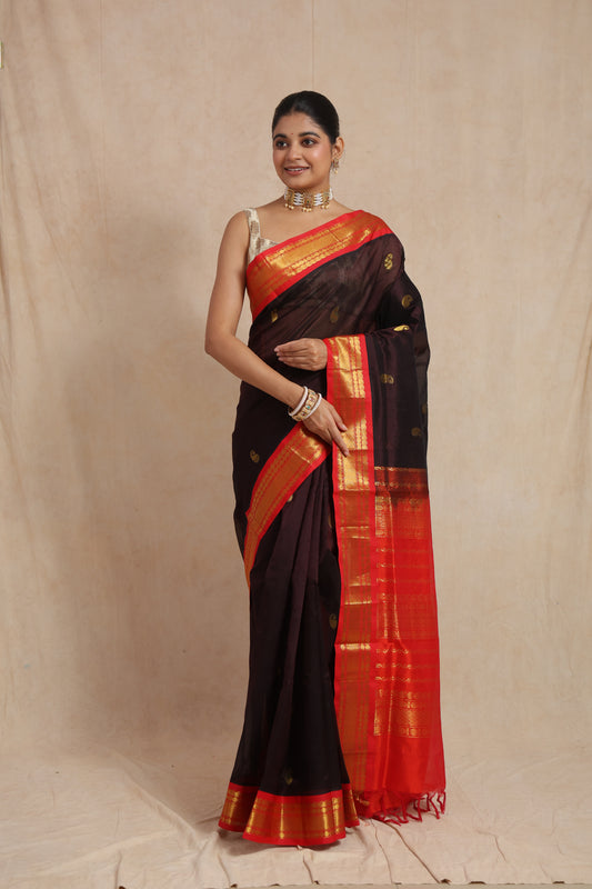 Full view of black Kanchipuram Sico saree with red zari border and paisley buttas